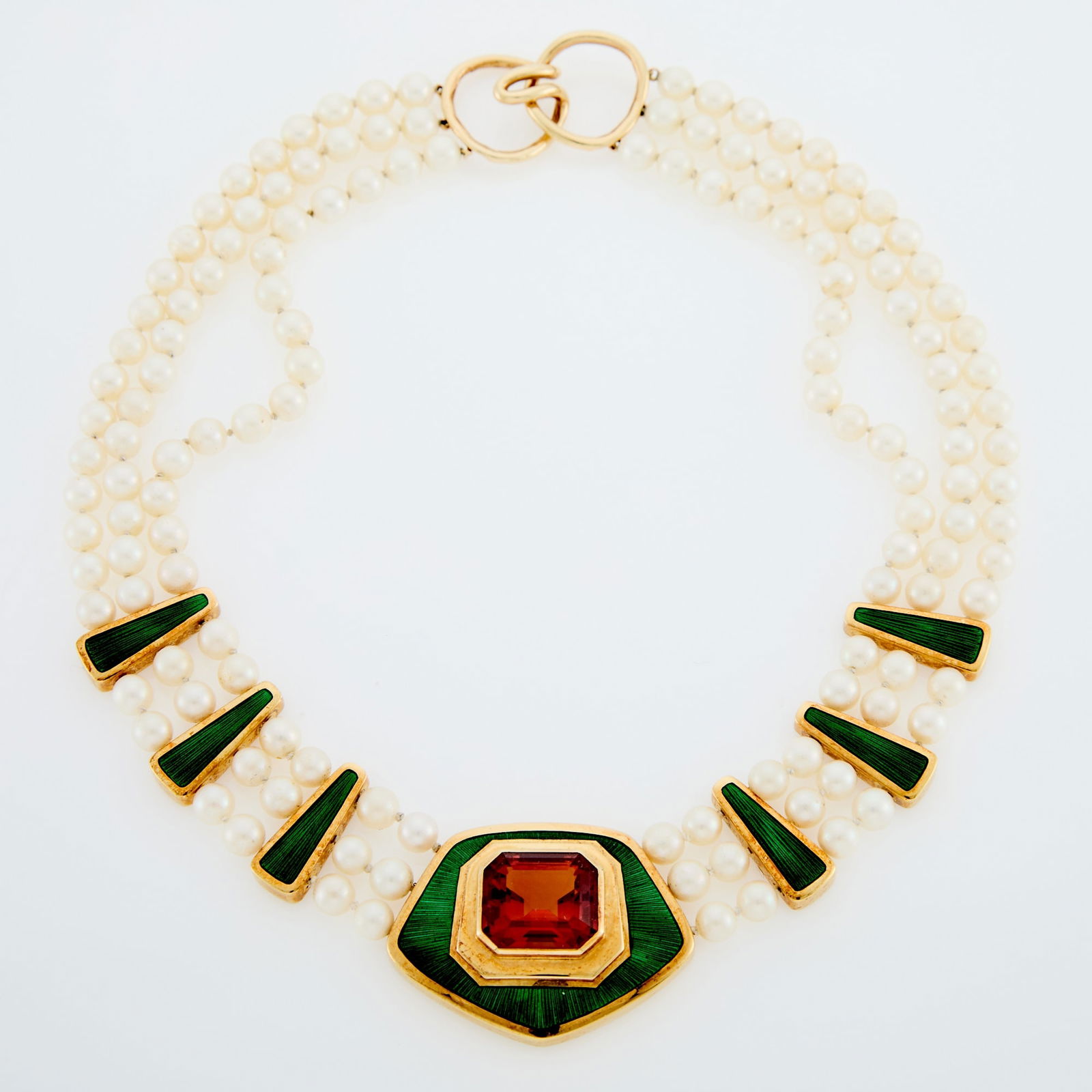 Leo De Vroomen Gold, Cultured Pearl, Citrine and Green Enamel Three Strand Necklace: 18 kt., one emerald cut citrine ap. 20.00 cts., pearls ap. 6.5 to 6.0 mm., green enamel, Signed LDV, with English hallmarks, c. 1985, ap. 62 dwts. gross. Length 16 inches. Citrine: deep, medium