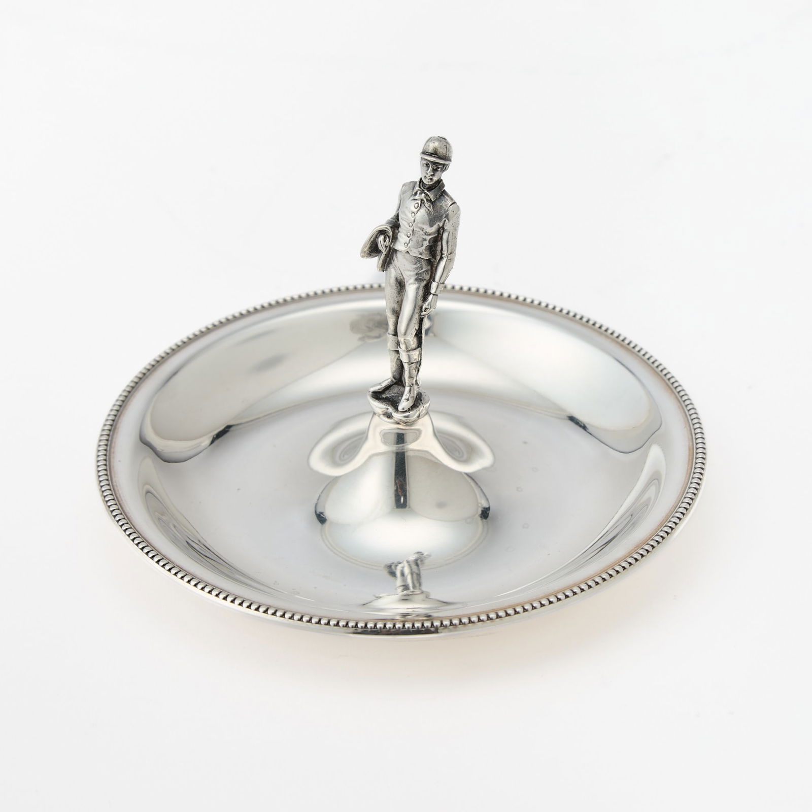 Tiffany & Co. Sterling Silver Coin Dish with Jockey Finial: New York, 1956-1965 Circular, with jockey finial. Marked on base. Diameter 5 inches, approximately 4 ounces. Overall very good condition.