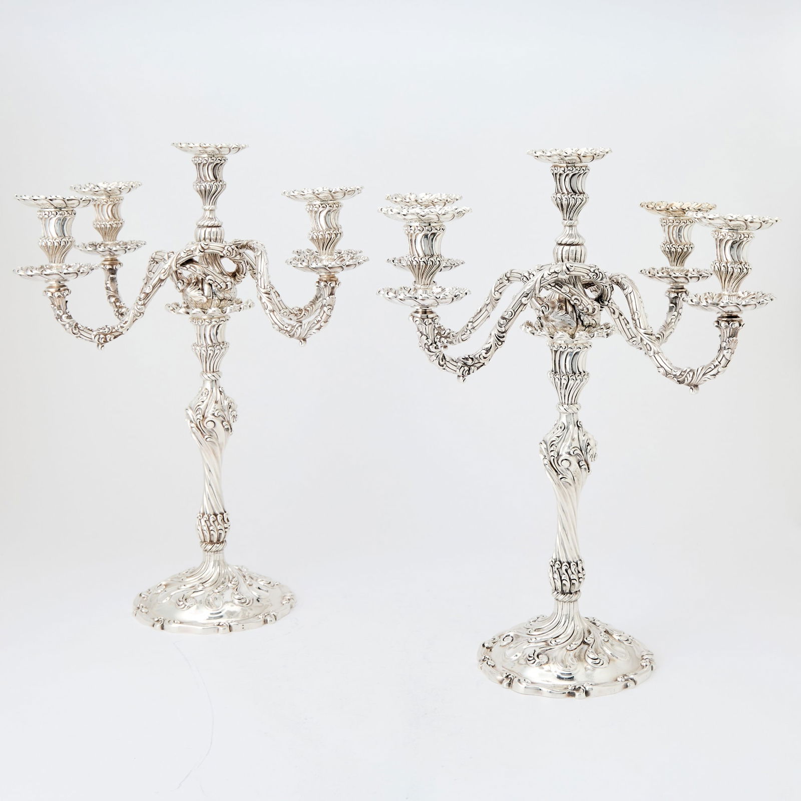 Pair of American Sterling Silver Five-Light Candelabra, Presented to Gertrude Vanderbilt Whitney: Howard & Co., New York, 1896 The spiral-fluted, baluster-form base supporting a detachable five light, four-arm branch, the base and arms with detatchable wax pans, the bases engraved Gertrude Van