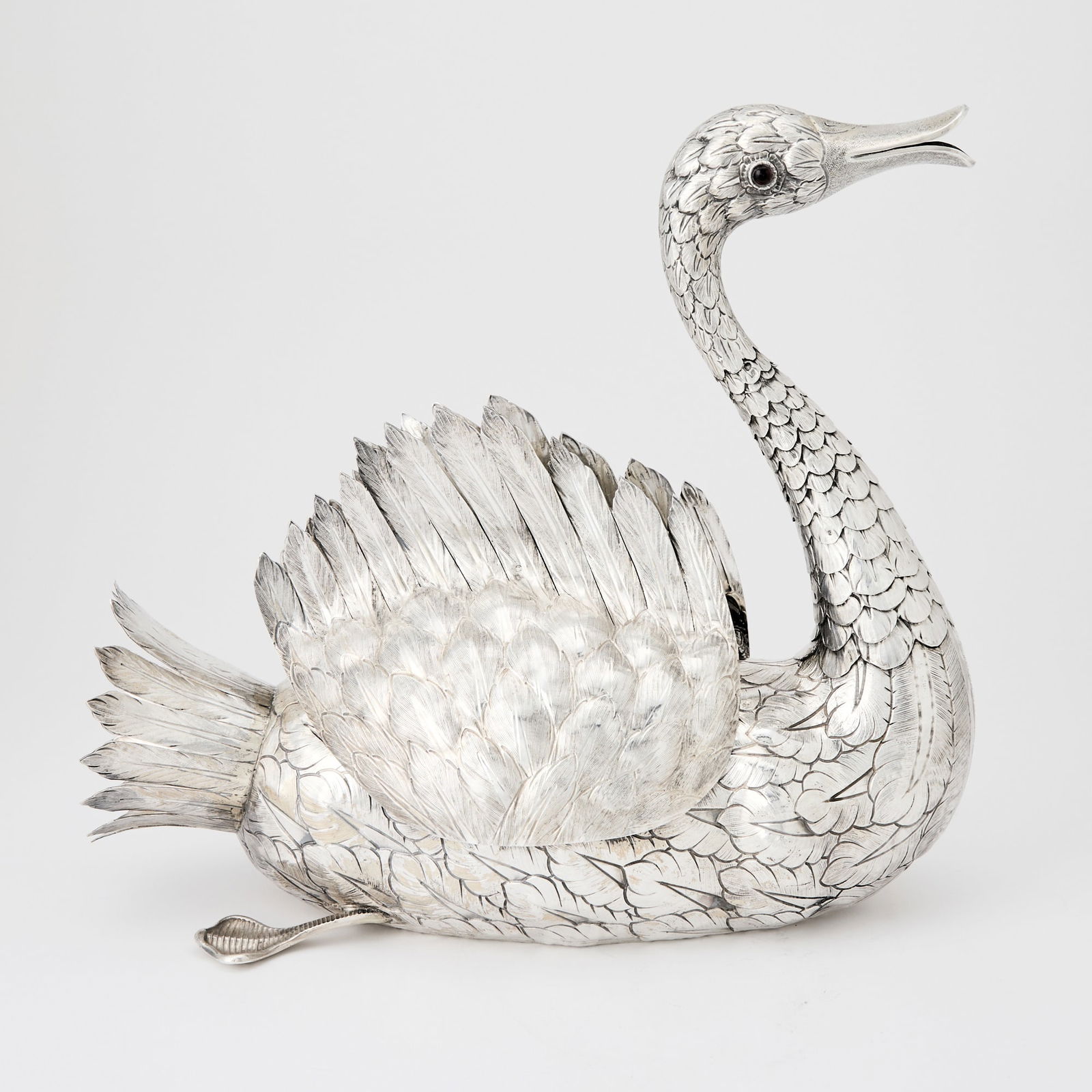 Portuguese Silver Swan Centerpiece: Manuel Alcino, Porto, 20th century The swan with flexible neck and hinged wings, marked on base. Length 19 inches, approximately 78 ounces.