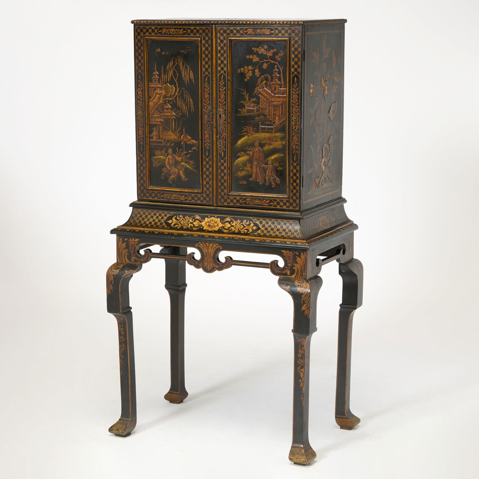 William and Mary Style Chinoiserie Black and Gilt Decorated Collector's Cabinet: 20th Century The interior fitted with small drawers. Height 57 inches, width 30 inches, depth 19 inches.