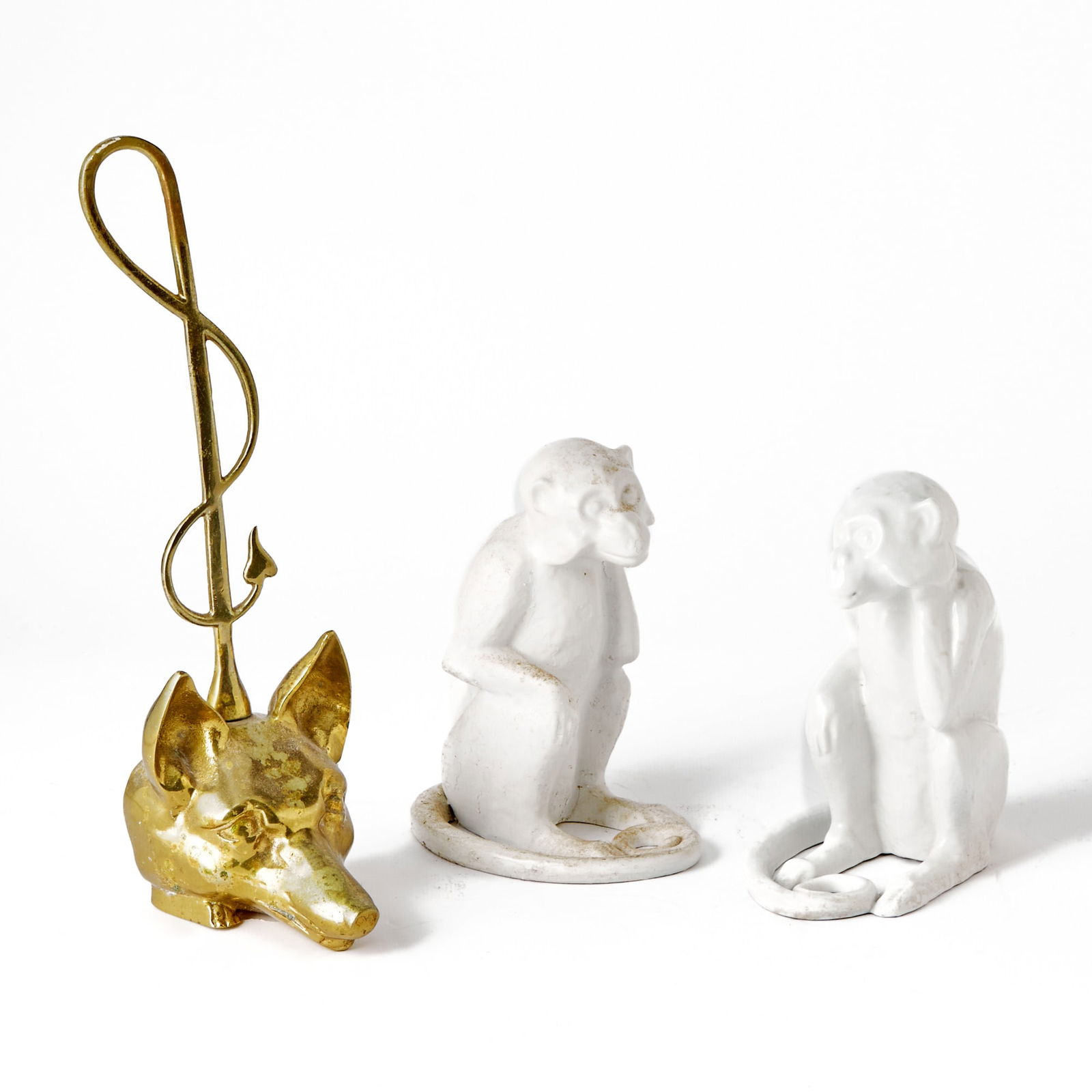 Pair of Painted Cast Iron Monkey Doorstops: 20th Century Height 8 1/2 inches; Together with a Brass Fox Head and Riding Crop Door Stop. 20th Century.