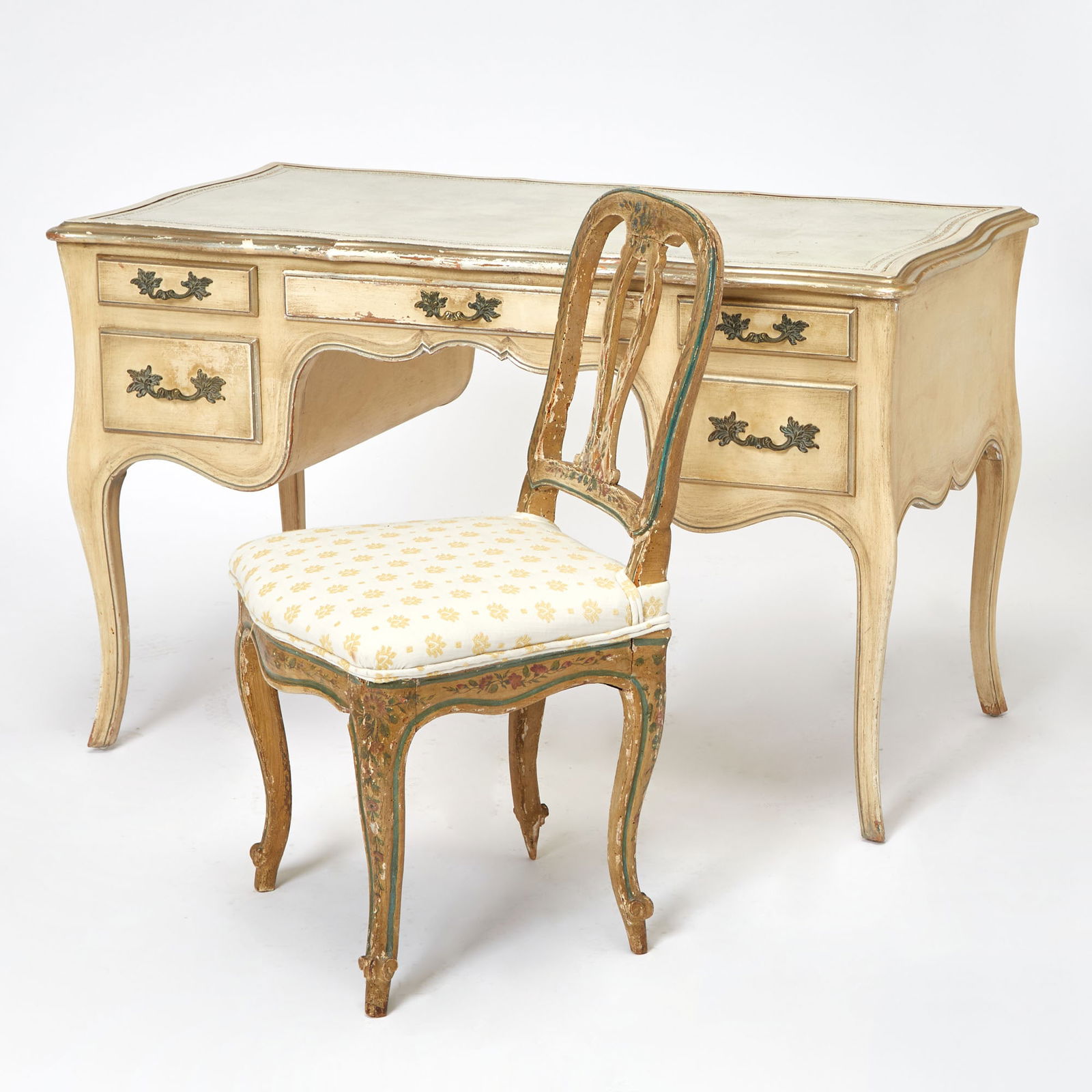 Louis XV Style Painted Ladies Desk: 20th Century With a gilt tooled leather inset top, height 29 1/2 inches, width 48 inches, depth 26 inches; Together with a Louis XV Style Painted Side Chair. Height 35 inches, width 20 inches, depth 1