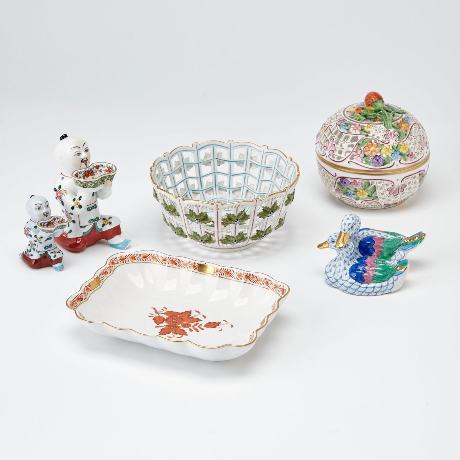 Group of Herend Hand-Painted Porcelain Articles: Comprising a small reticutated "trellis" bowl, height 3 1/8 inches, diameter 6 1/8 inches; a small reticulated floral decorated globular "trellis" box and cover, with a strawberry finial; two