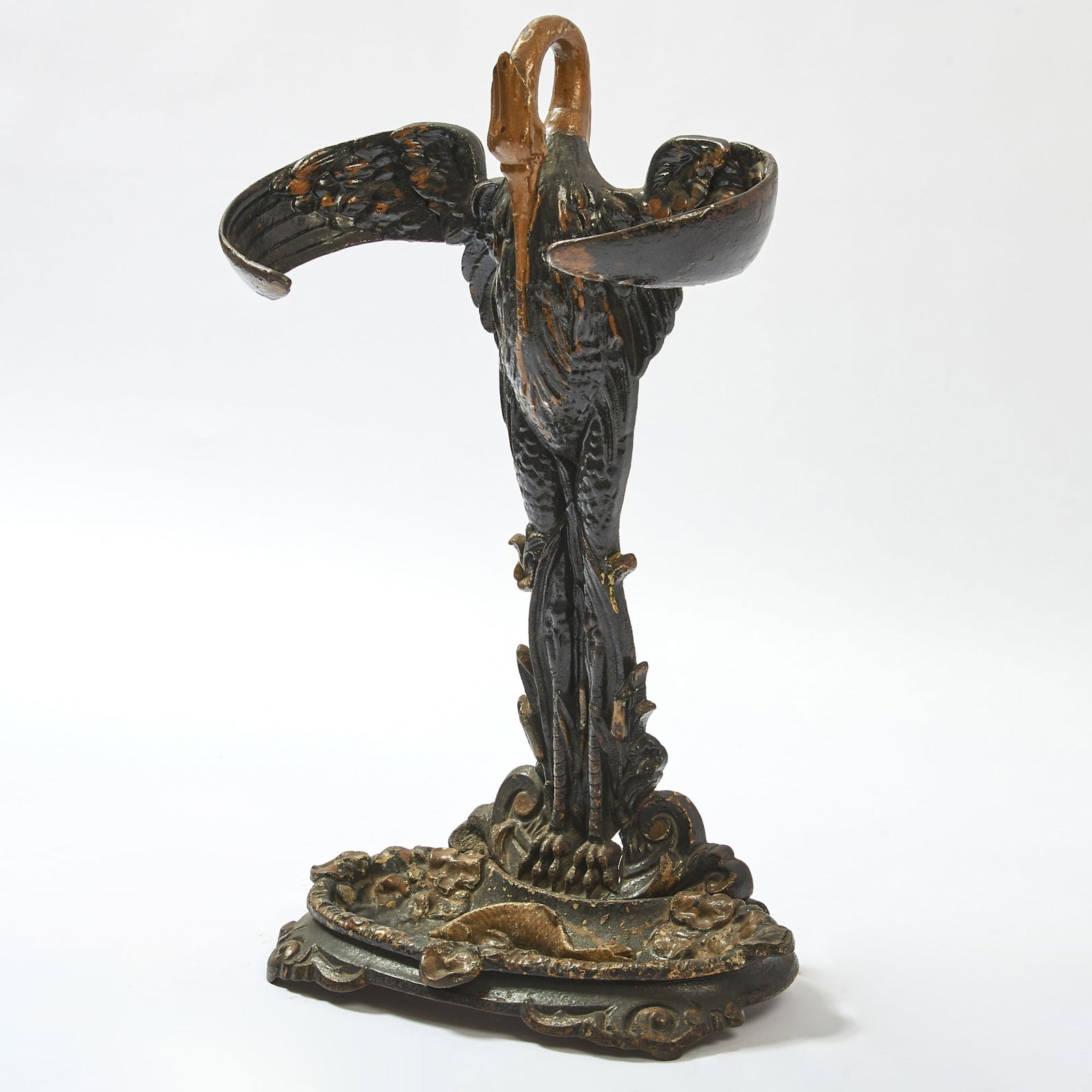 Victorian Parcel Gilt and Painted Cast Iron Pelican Umbrella Stand: Height 25 inches, width 16 inches, depth 8 inches. small broken part on lower right section