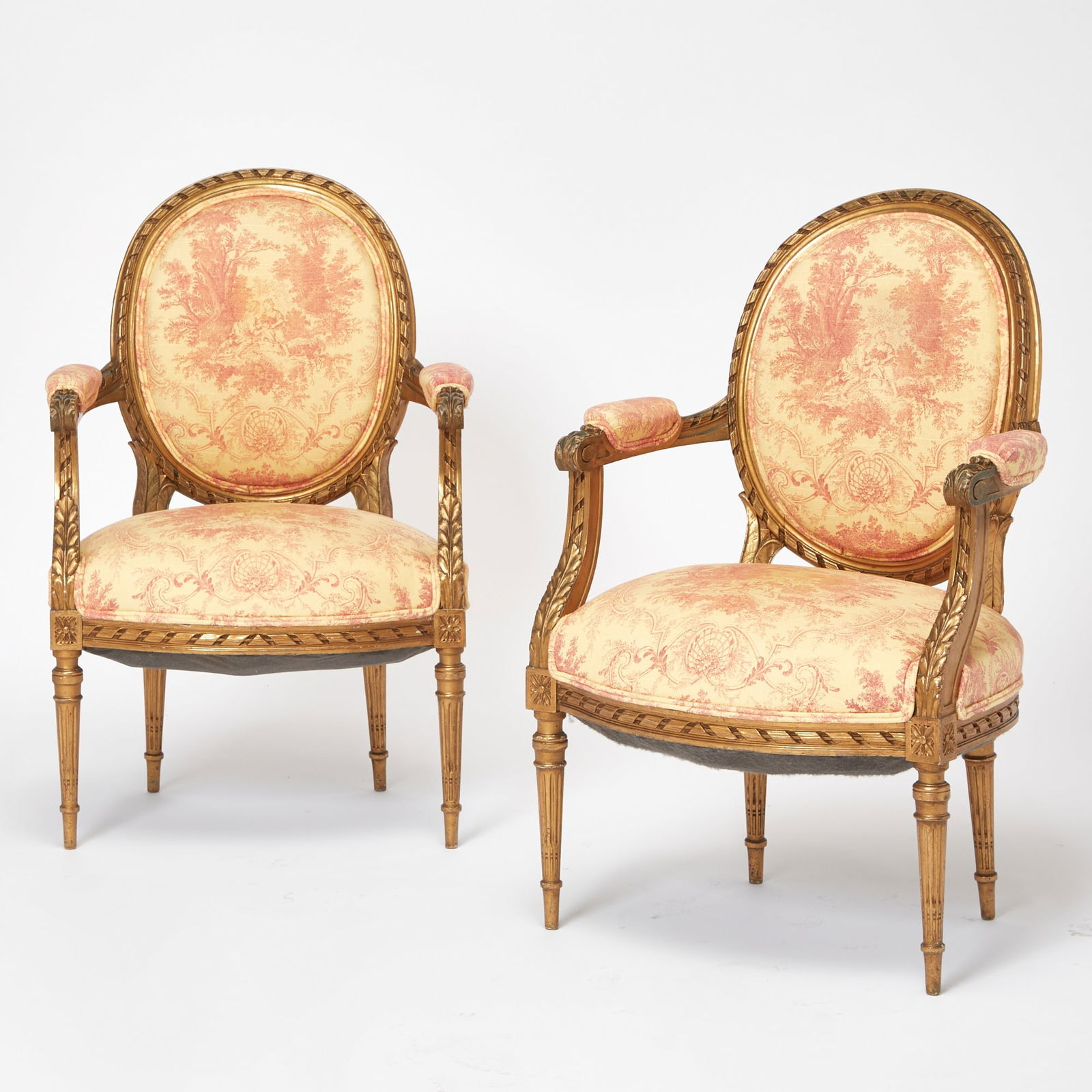 Pair of Louis XVI Style Upholstered Gilt Painted Fauteuils: 20th CenturyHeight 36 1/2 inches, width 24 1/2 inches, depth 18 inches. 