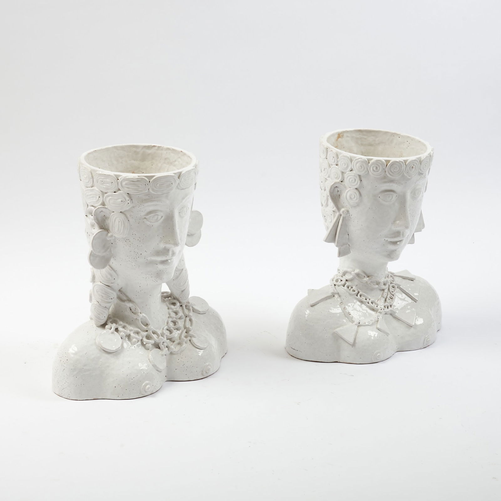 Pair of White Glazed Ceramic Figural Planters: 20th Century Labeled Made in Italy. Height 18 inches, width 18 inches, 12 inches.