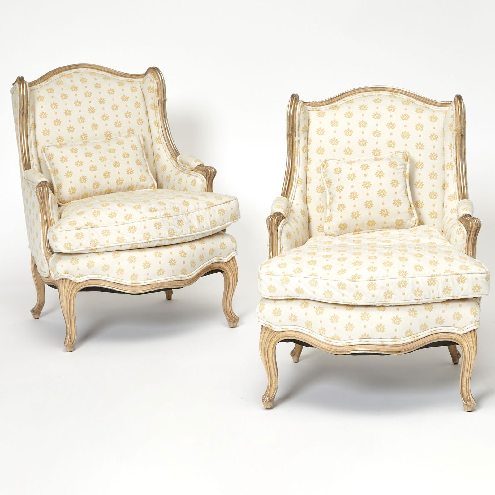 Pair of Louis XV Style Upholstered Bergères à l'Oreilles: 20th Century Height 33 1/2 inches, width 24 1/2 inches, depth 21 inches.