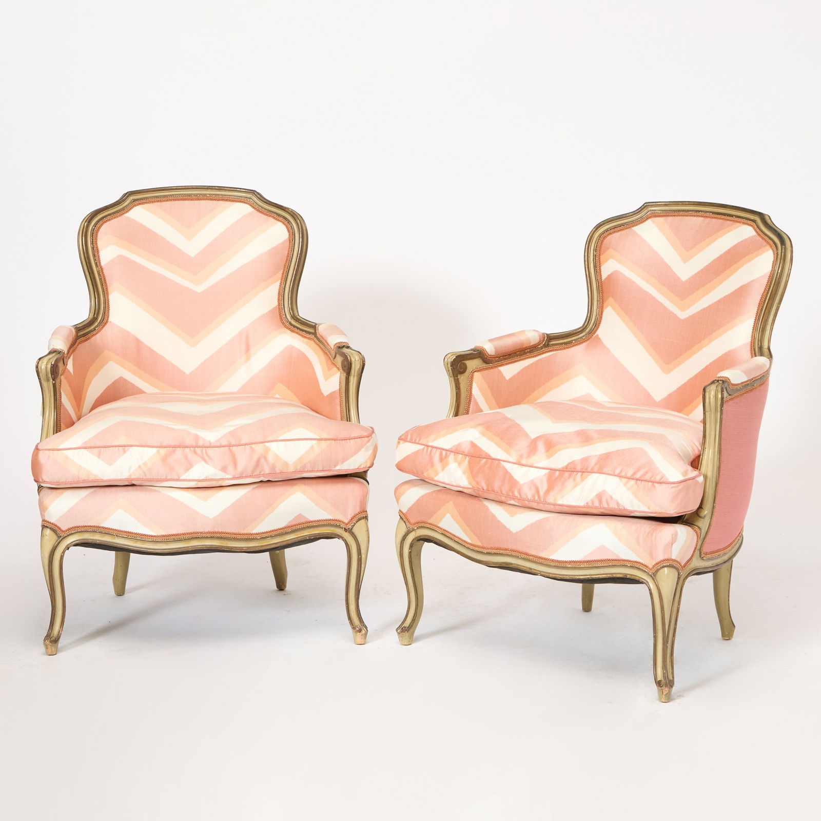 Pair of Louis XV Style Upholstered Painted Bergères: Late 20th century Height 36 inches, width 27 inches, depth 24 inches. scratched edges