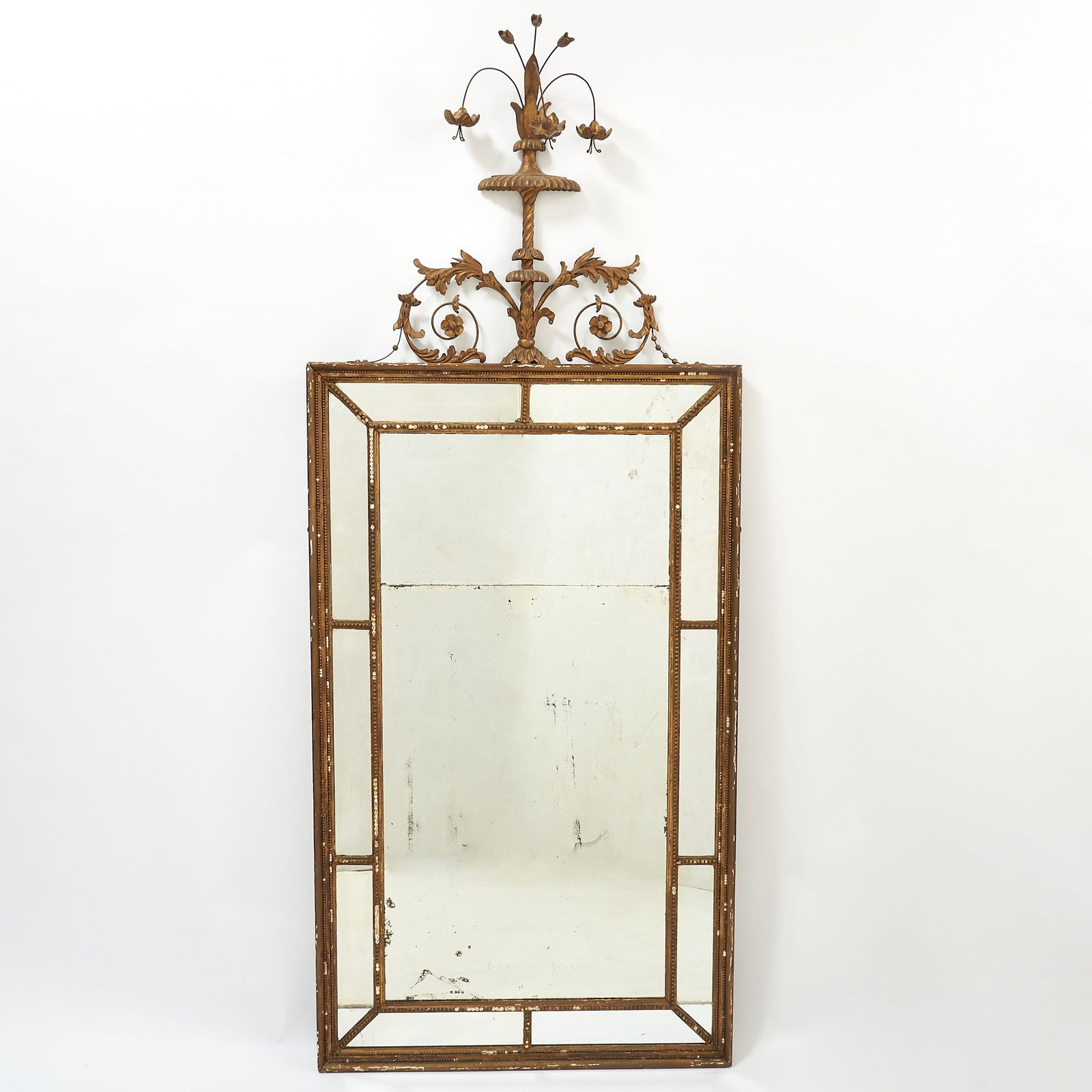 George III Giltwood Mirror: Late 18th century In the Adam style. Height 67 inches, width 28 1/2 inches. several chips and small losses
