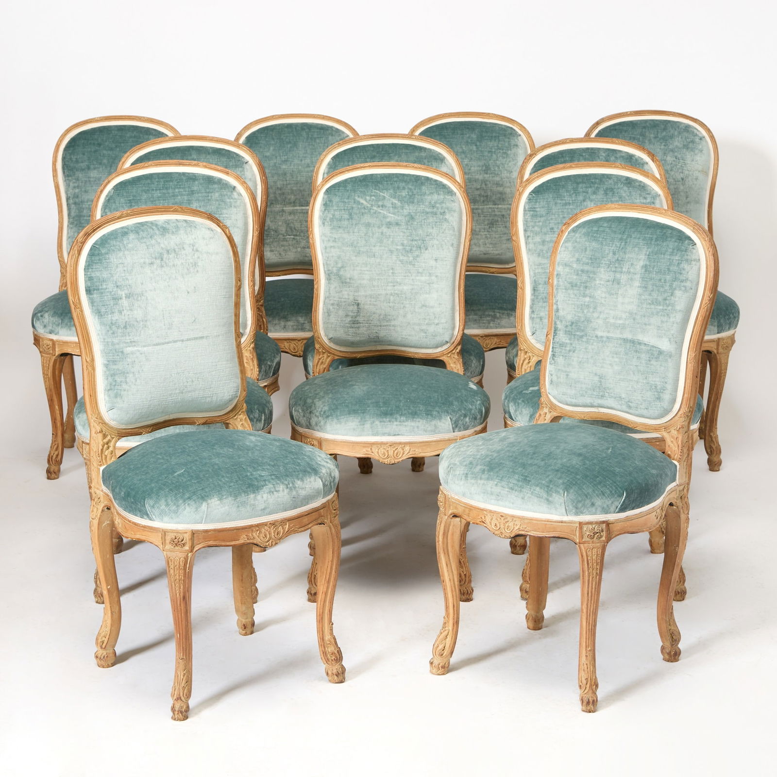 Set of Twelve Louis XVI Style Upholstered Carved Beech Wood Dining Side Chairs: Mid-20th century Height 40 1/2 inches, width 19 inches, depth 18 inches; height of seat 19 inches.