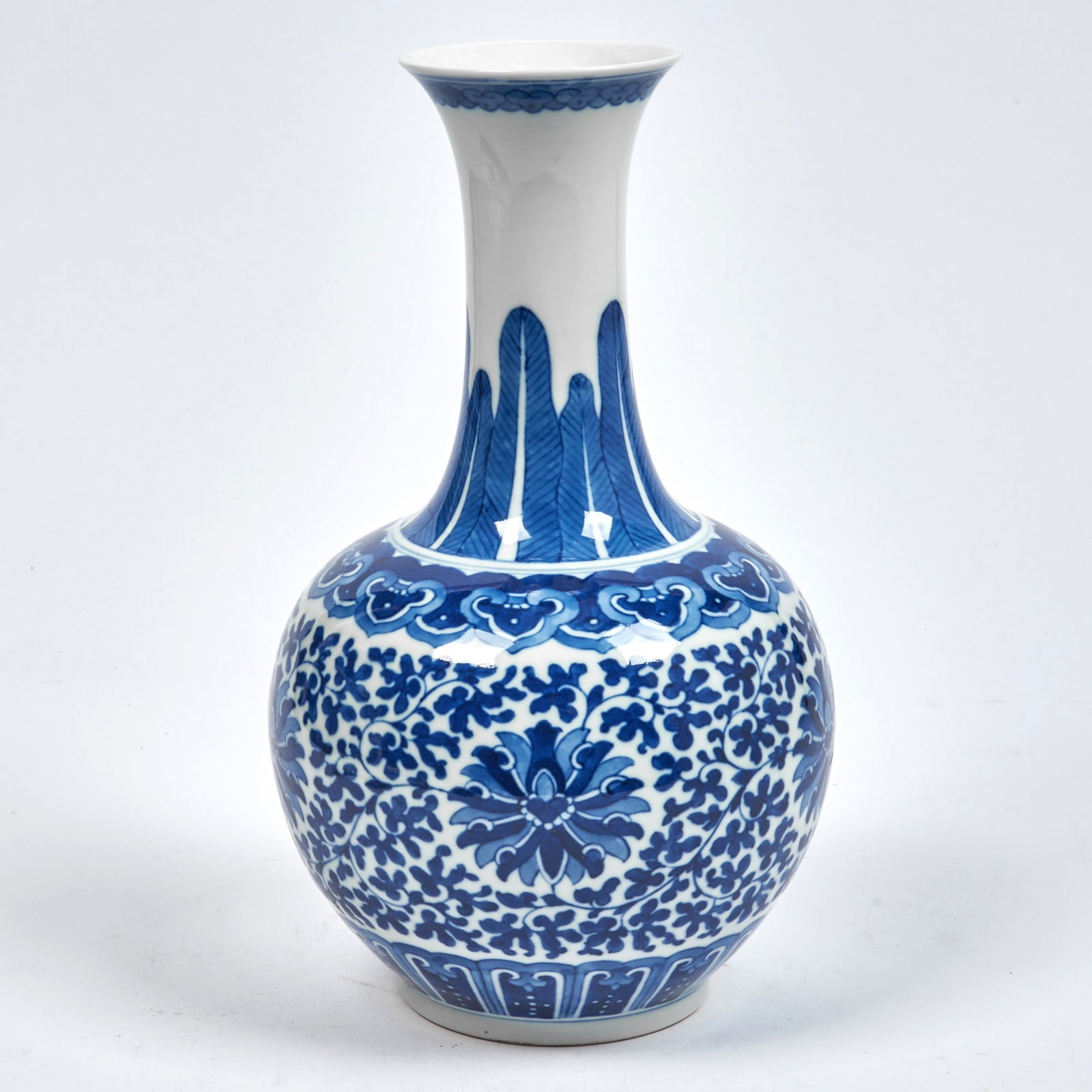 A Chinese Blue and White Porcelain 'Lotus Scrolls' Bottle Vase Wanli Mark, 20th century: Height 11 3/4 inches Overall good condition.