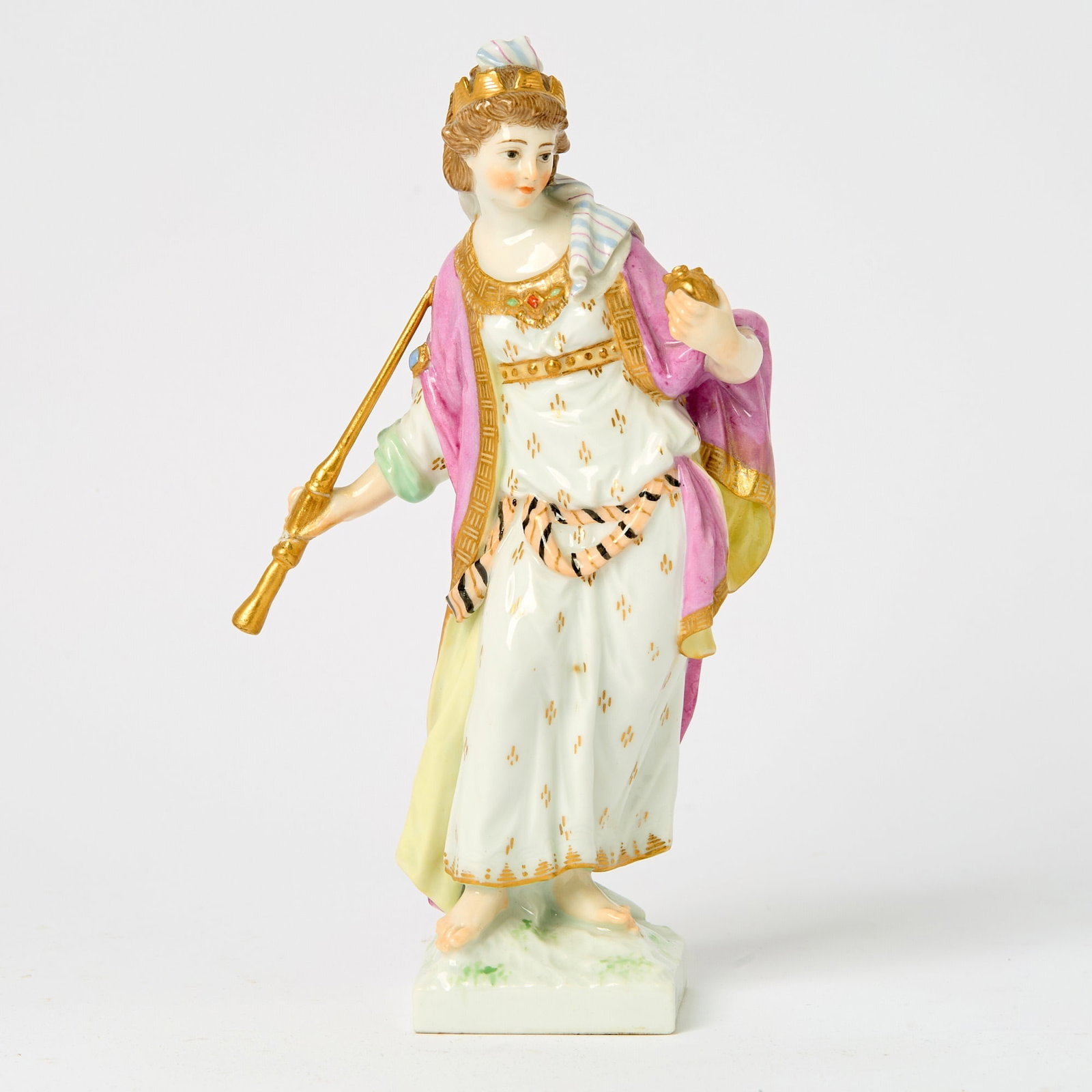 Berlin Porcelain Figure of Proserpina: Last quarter 18th century Realistically modeled, depicting a standing female adorned with a gilt crown, puce robe, and white draped dress with a rope tie at the waist, holding a horn in her right hand