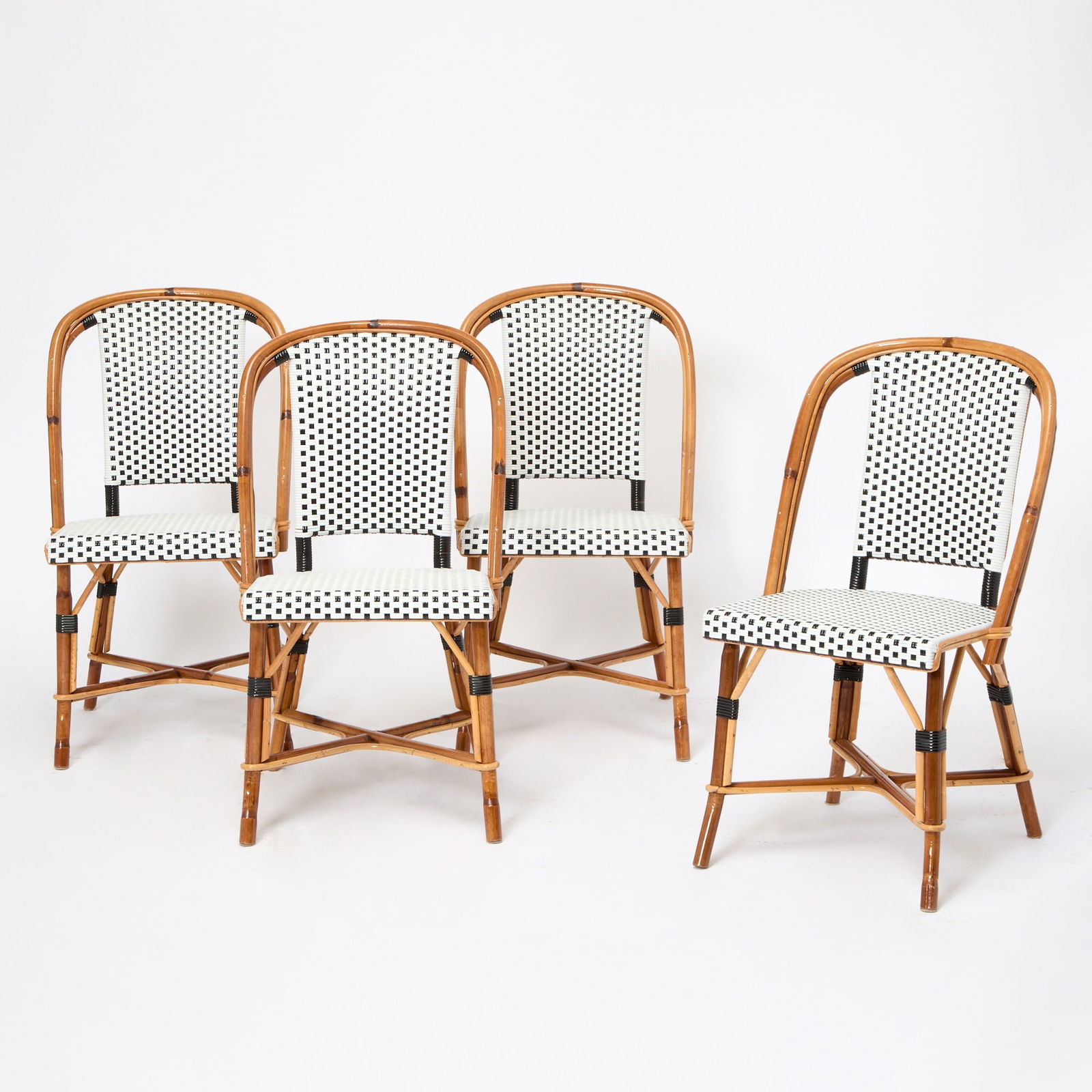 Set of Four Rattan Side Chairs: Height 34 1/2 inches, width 19 1/2 inches, depth of seat 16 1/2 inches.