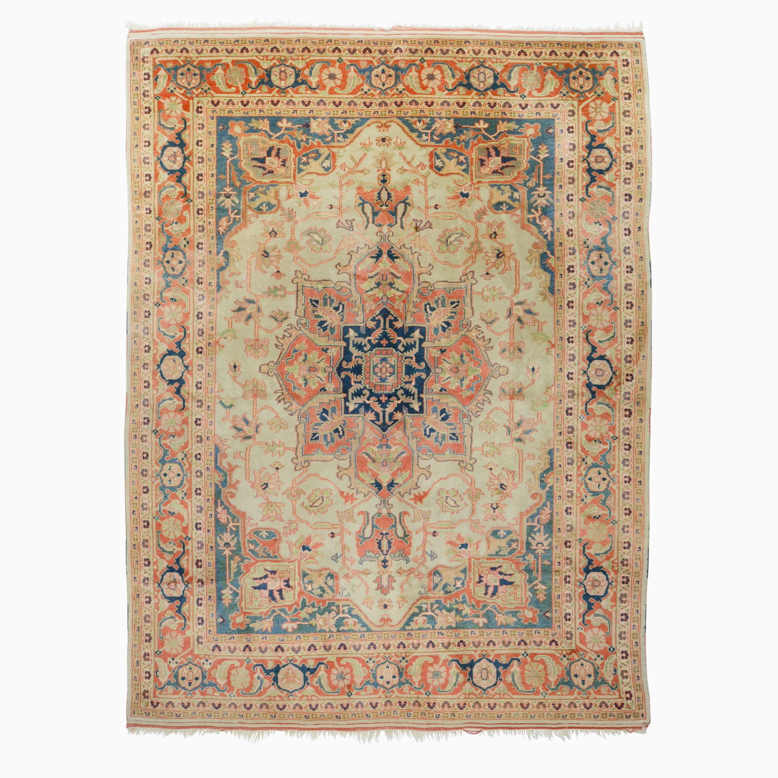 Serapi-Style Carpet: Turkey, Contemporary The central geometric medallion on the buff field flanked by indigo spandrels is within a madder palmette and vine border. (11' 1" x 8' 7") Spot stains, minor losses to fringes