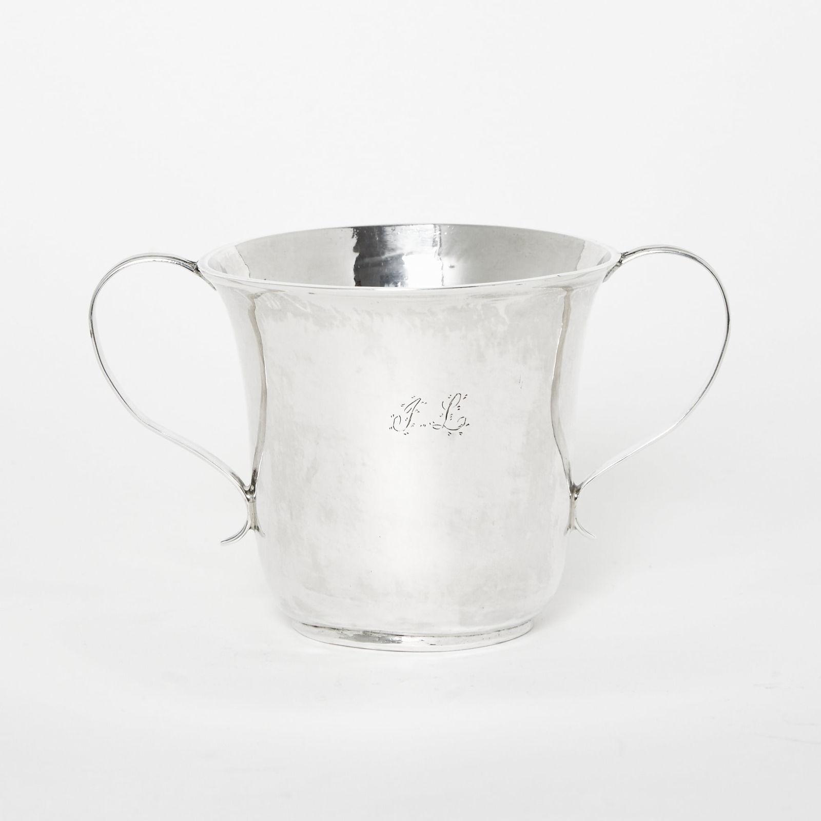 George III Sterling Silver Two Handled Cup: John Langlands, Newcastle, Second half 18th centuryCylindrical with flared rim, with reeded loop handles. Height 3 3/4 inches, length over handles 6 1/2 inches, approximately 5 ounces.Provenance: