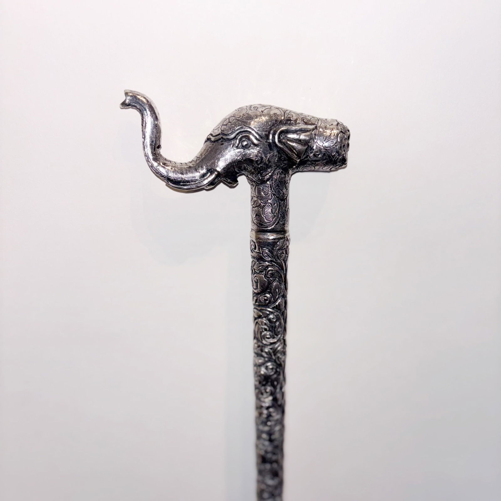 Indian Silver Walking Stick: Probably late 19th/ early 20th centuryWith elephant-form handle. Length 36 inches. In two pieces with screwing fixture at mid point