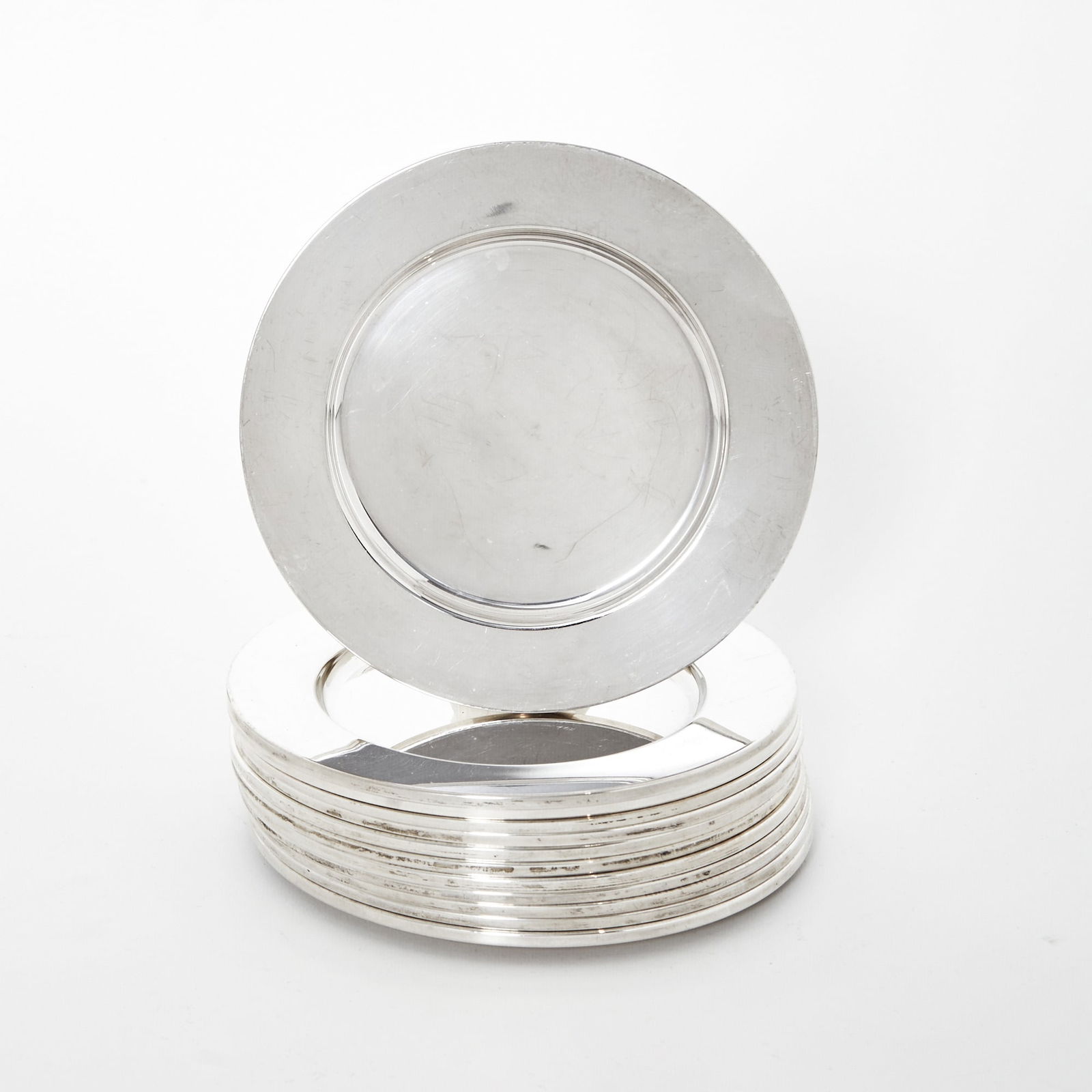 Set of Twelve American Sterling Silver Bread Plates: Worden Munnis, Boston, Mid 20th CenturyDiameter 6 1/4 inches, total approximately 38 ounces. Generally good condition overall; light surface marking from casual use