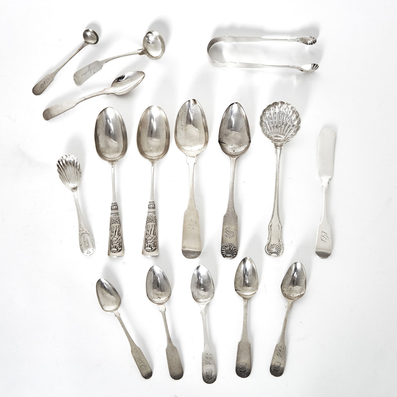 Group of Charleston Silver Flatware: 19th CenturyComprising:Pair of tablespoons marked Carrington Thomas & Co., length 8 1/4 inches Sugar spoon marked W. Carrington & Co., length 5 1/2 inches Master butter knife marked W.