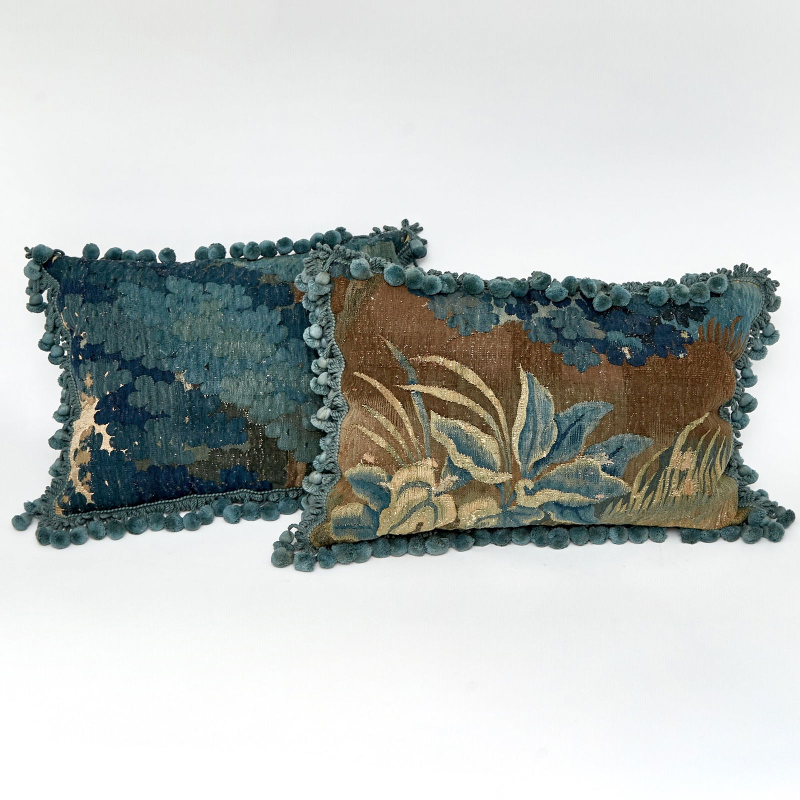 Pair of Flemish Cushions: The tapestry 17th centuryLengths 22 inches and 19 inches.