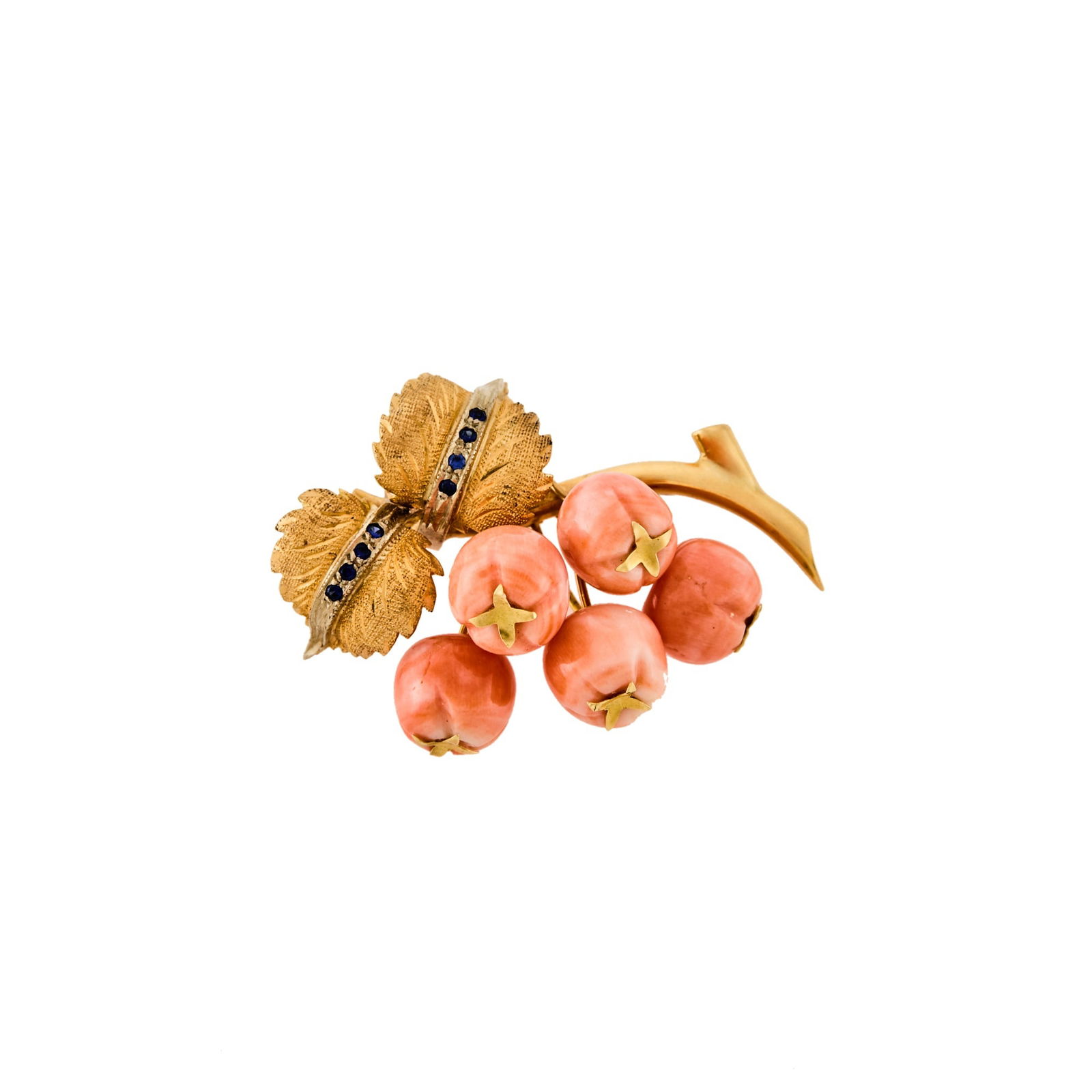 Gold, Carved Coral and Sapphire Berry Brooch: 18 kt., carved coral berries, small round sapphires, ap. 13 dwts. gross. Coral: peachy pink with white moltting, good luster.1 7/8 x 1 3/8 inches.