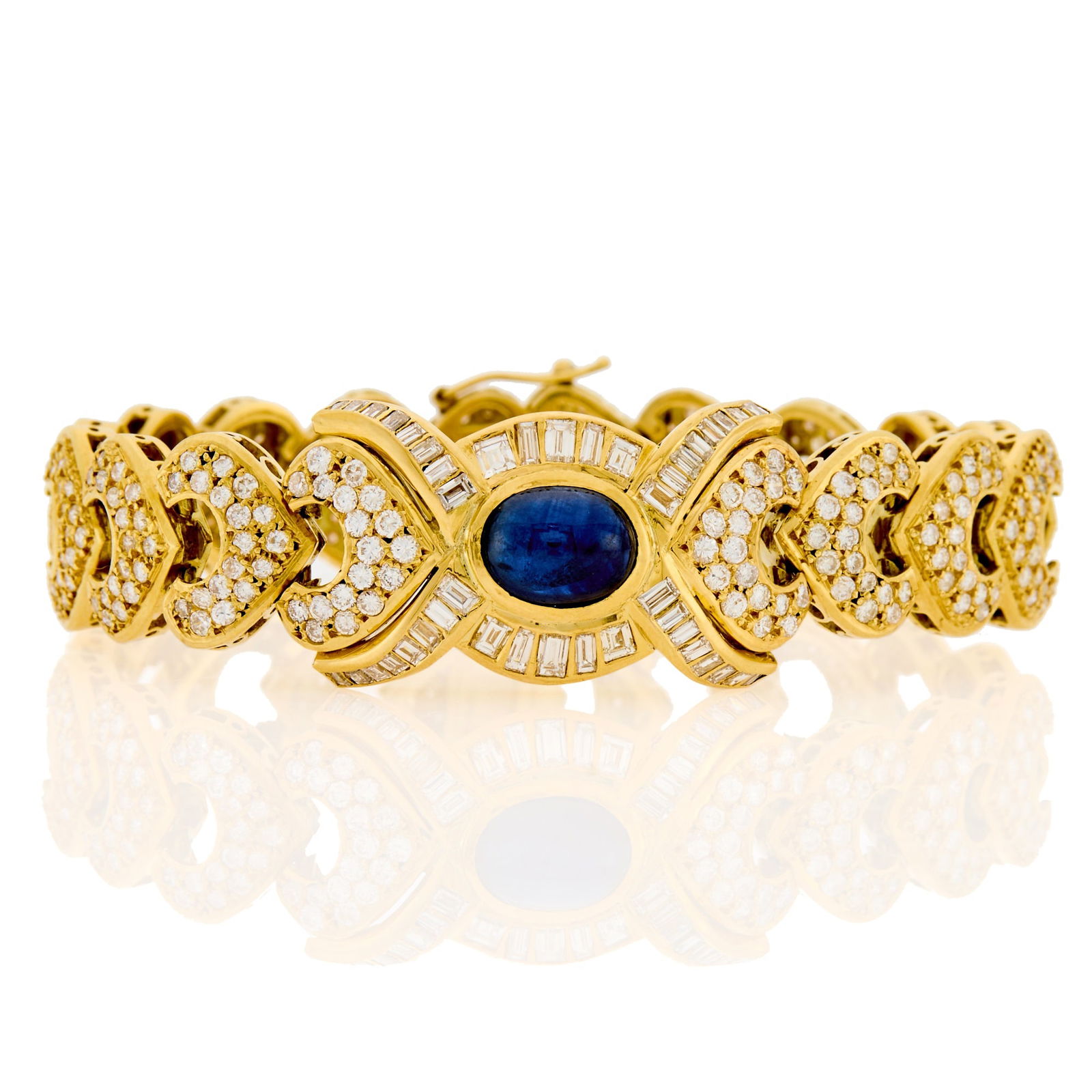 Gold, Cabochon Sapphire and Diamond Bracelet: One oval cabochon sapphire ap. 4.85 cts., 366 round diamonds ap. 7.50 cts., ap. 33.6 dwts. Length 6 7/8 inches. Tests as 18 kt. Sapphire: deep velvety blue, moderately included.