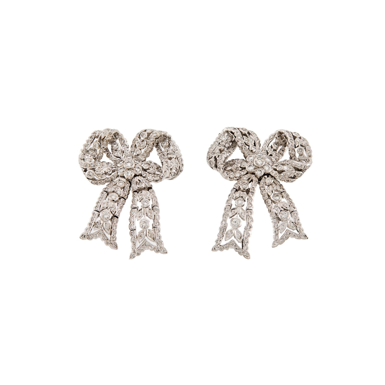 Pair of White Gold and Diamond Bow Earrings: Small round diamonds ap. 1.85 cts., ap. 14.4 dwts. Tests as 14 kt.Posts. 1 1/4 x 1 1/16 inches.