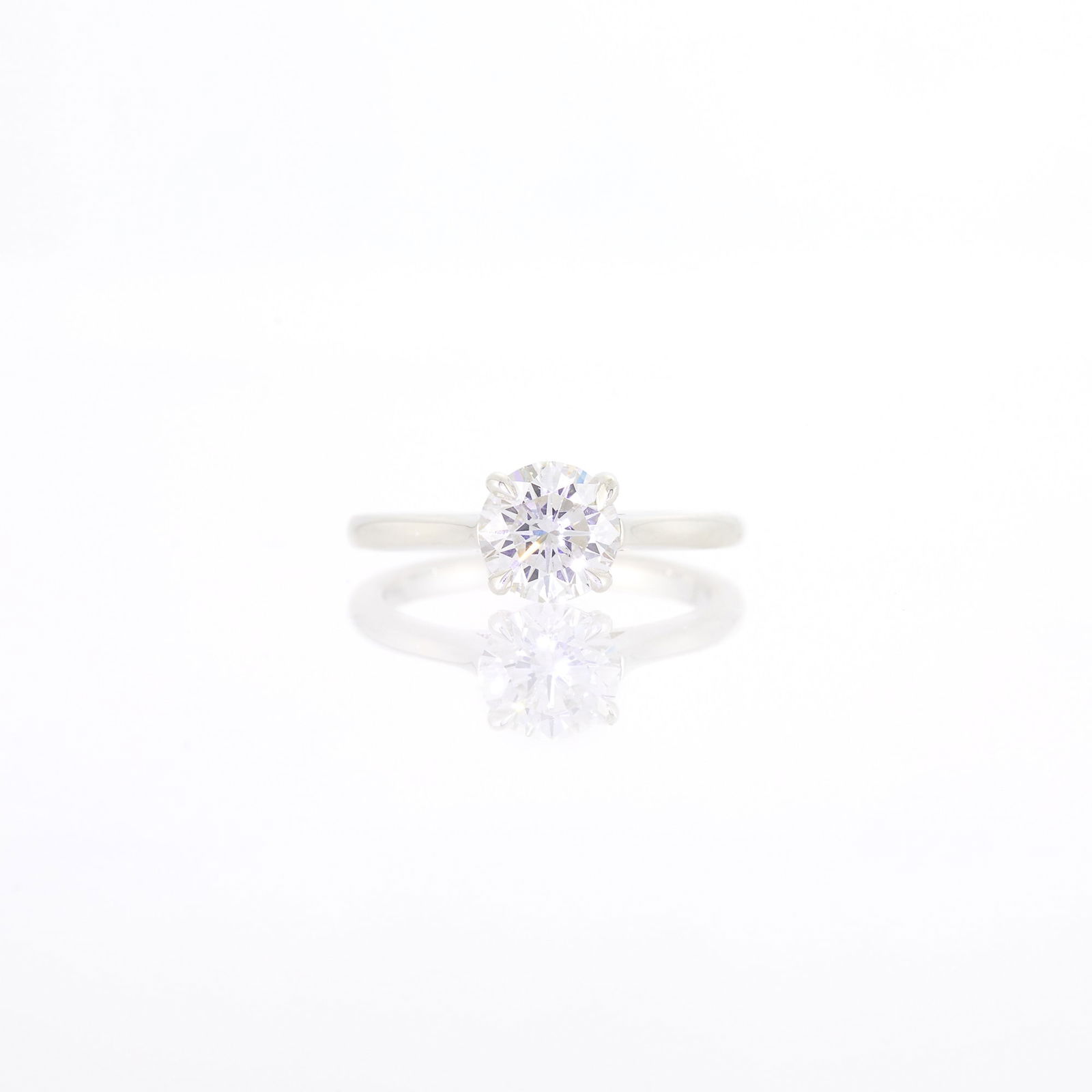 Silver and Diamond Ring: One round diamond weighing 1.31 cts. Size 6. With GIA report no. 1232857417 stating G color, VS2 clarity. Diamond: G-VS2, no fluorescence