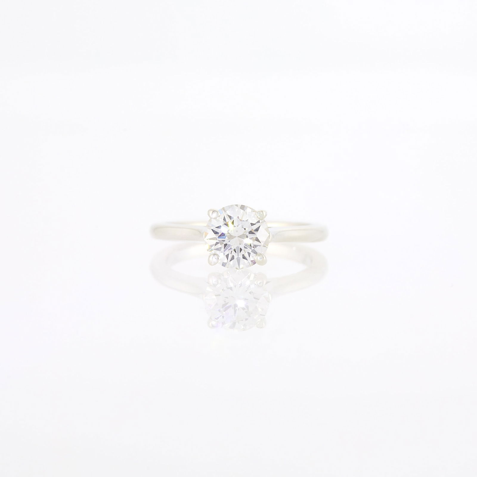 Silver and Diamond Ring: One round diamond weighing 1.30 cts. Size 6. With GIA report no. 5231857411 stating G color, SI1 clarity. Diamond: G-SI1, no fluorescence