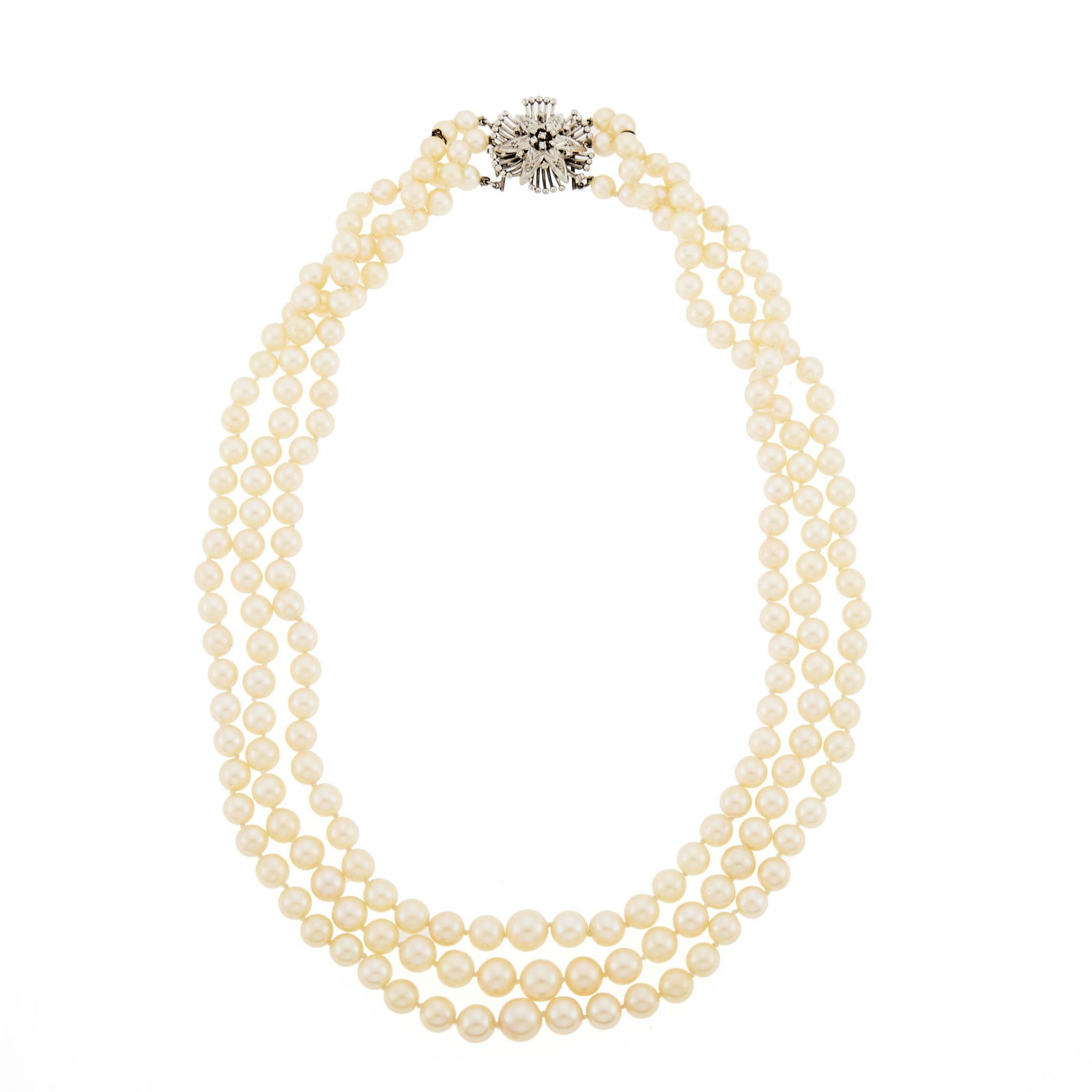 Triple Strand Cultured Pearl Necklace with Low Karat White Gold and Diamond Clasp: Pearls ap. 9.0 to 5.6 mm., small single-cut diamonds. Length 19 1/4 inches. Clasp tests as 10 kt.Pearls: creamy white with rose and green undertones, medium luster.