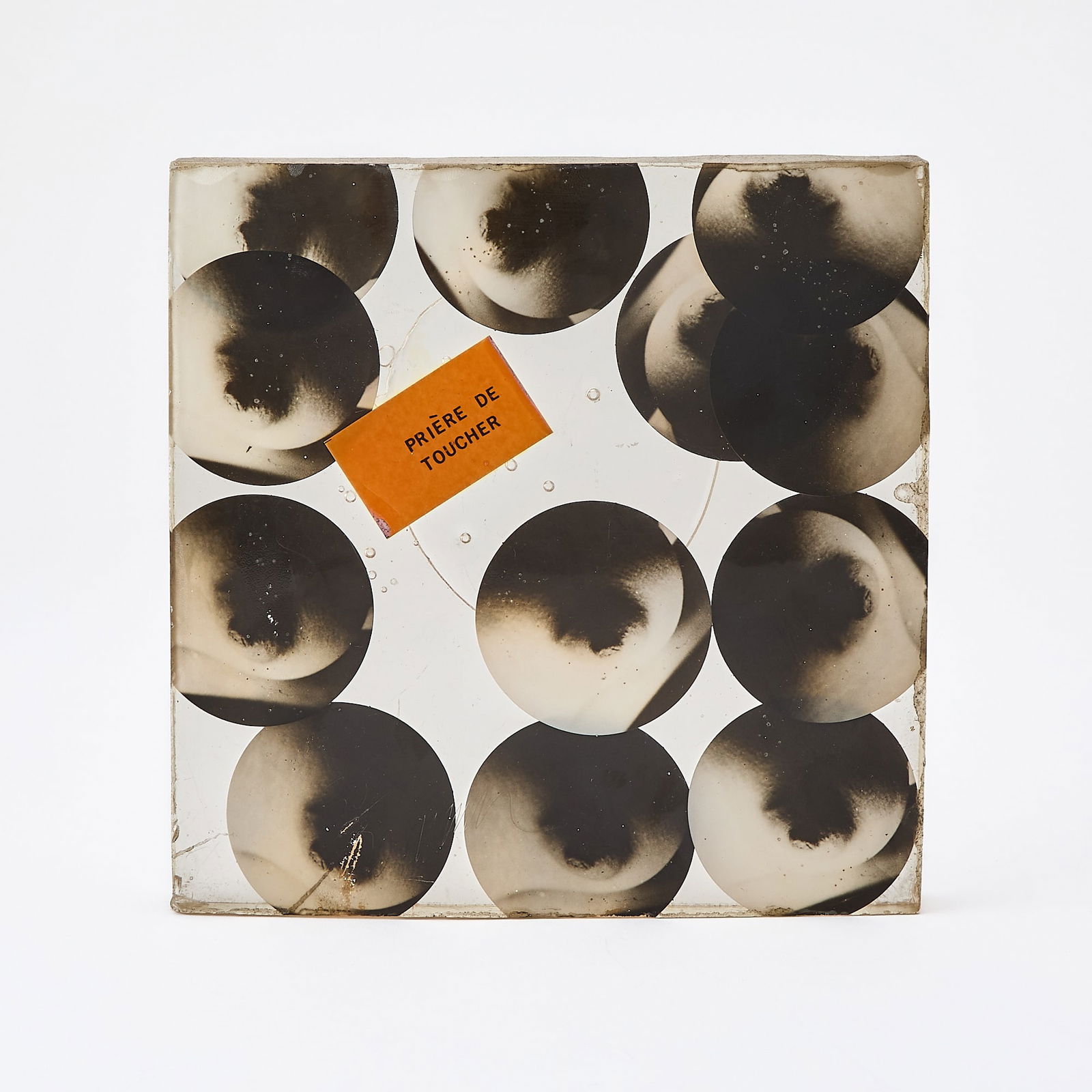 Arman (1928-2005): HOMMAGE À DUCHAMP: TO AND FOR ROSE SELAVY Photographs cast in polyester resin multiple, 1973, with incised signature and numbered 30/90, published by The Philadelphia Museum of Art. 7 1/4 x 7