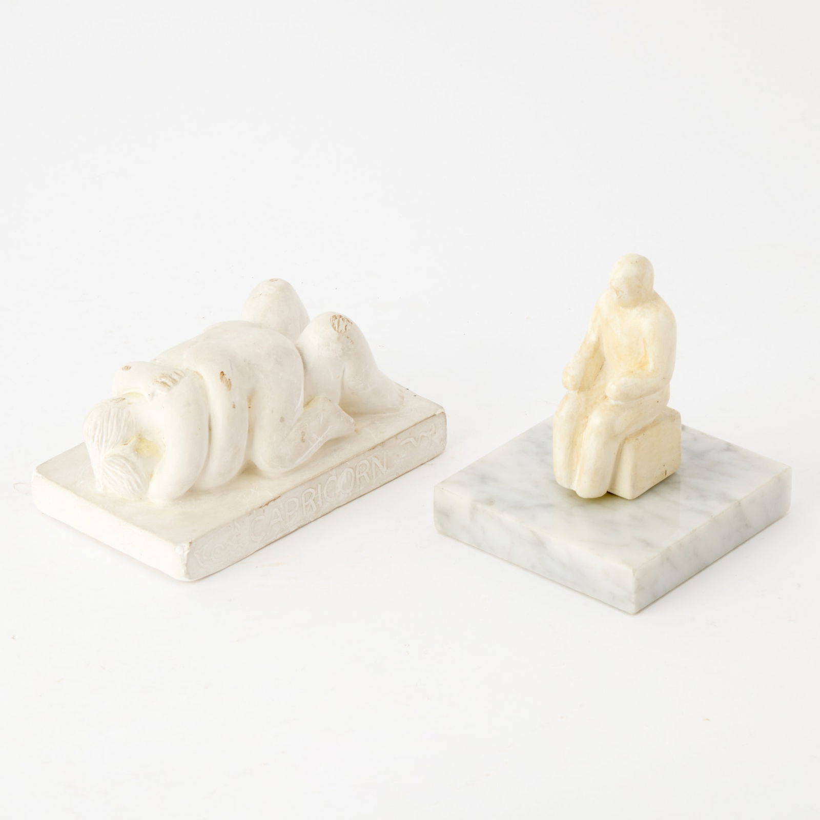 Tom Otterness (b. 1952): SITTING MAN II; CAPRICORN Two cast hydrocal multiples, 1978 and 1982, respectively, the first titled and numbered 156/250 in ink on the Brook Alexander publisher's label affixed to the base, the