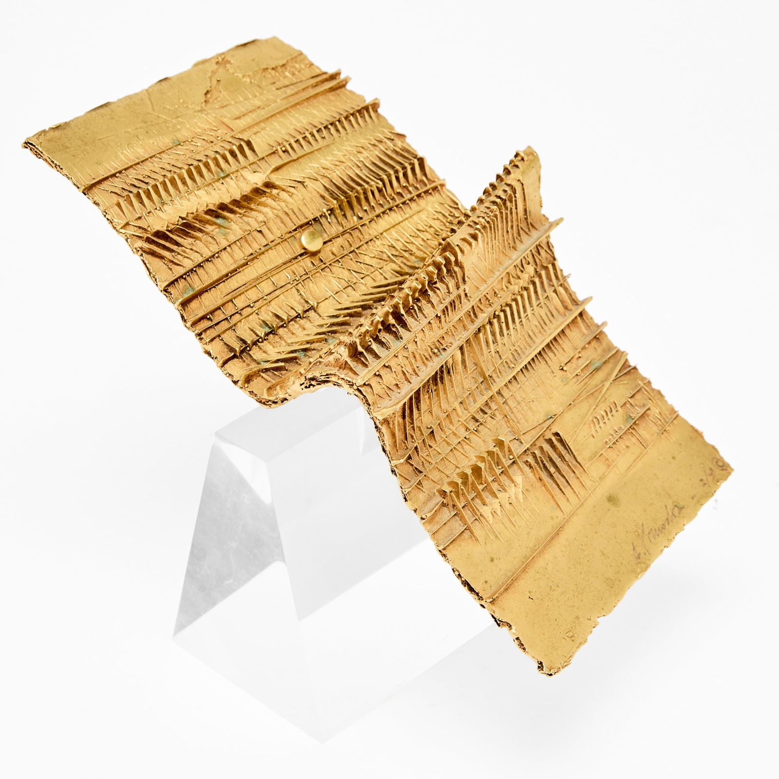Arnaldo Pomodoro: Italian, 1926-2025 Foglio III, 1985 Signed and numbered A. Pomodoro - 2/9 © near the edge Bronze with golden patina, on an acrylic base Overall 6 x 5 1/4 x 7 1/2 inches (15.2 x 13.3 x 19.1 cm) 
