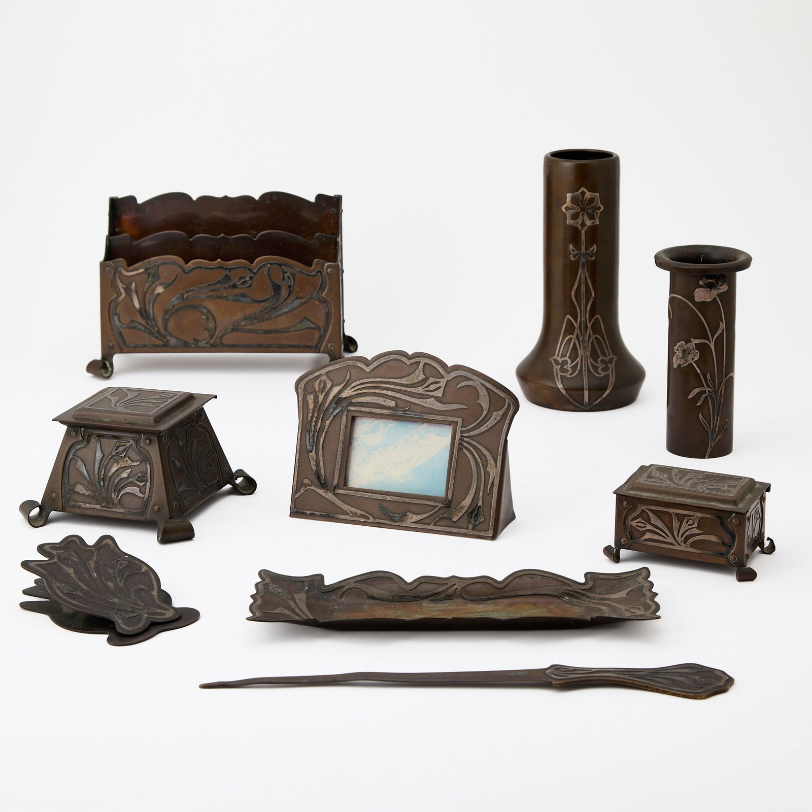 Heintz Art Metal Shop Sterling on Bronze Bud Vase: Circa 1912Of cylindrical form, decorated in the Art Nouveau style with a stylized flowering stem, signed with the company diamond logo, H.A.M.S., height 6 inches; Together With a Heintz Style Silver