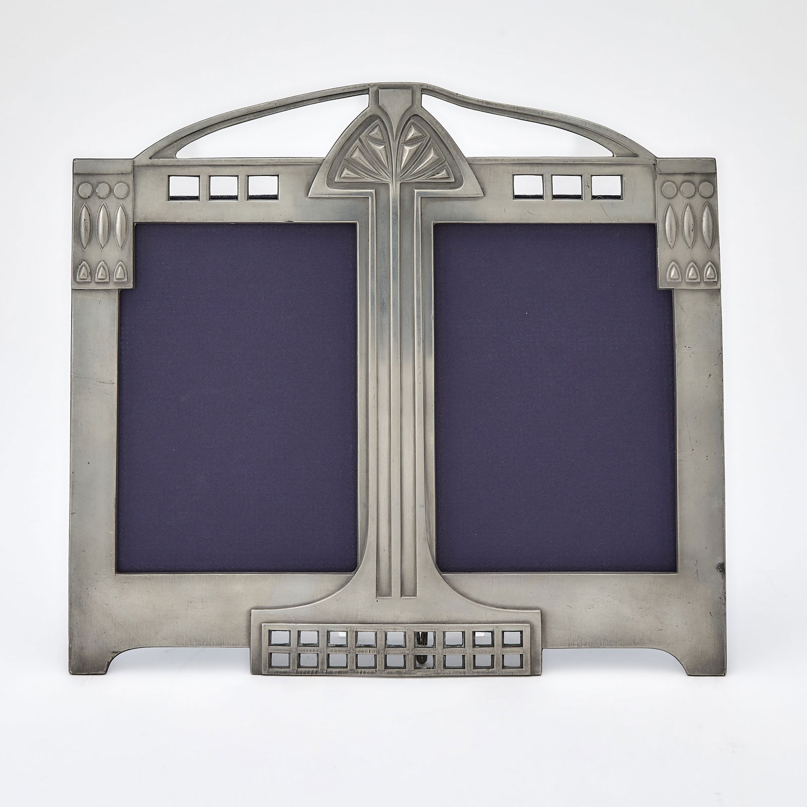 WMF Art Nouveau Silver Plated Metal Double Photograph Frame: Model no. 92/2, early 20th century In the Secessionist style, with openwork decorationeasel back, impressed WMF EP as. Height 9 5/8 inches, width 10 3/4 inches. See Art Nouveau Domestic Metalwork Fro