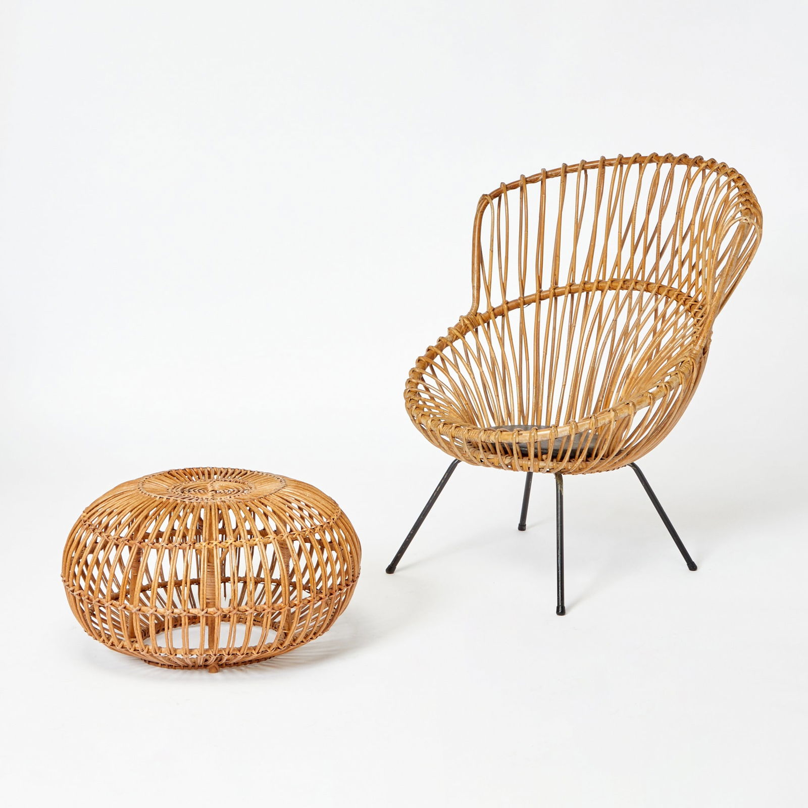 Attributed to Franco Albini Rattan Lounge Chair and Ottoman: 1970s Height of back 41 1/2 inches, height of seat 16 inches, width 32 1/2 inches, depth 29 inches; height of ottoman 13 1/2 inches, diameter 22 1/2 inches.