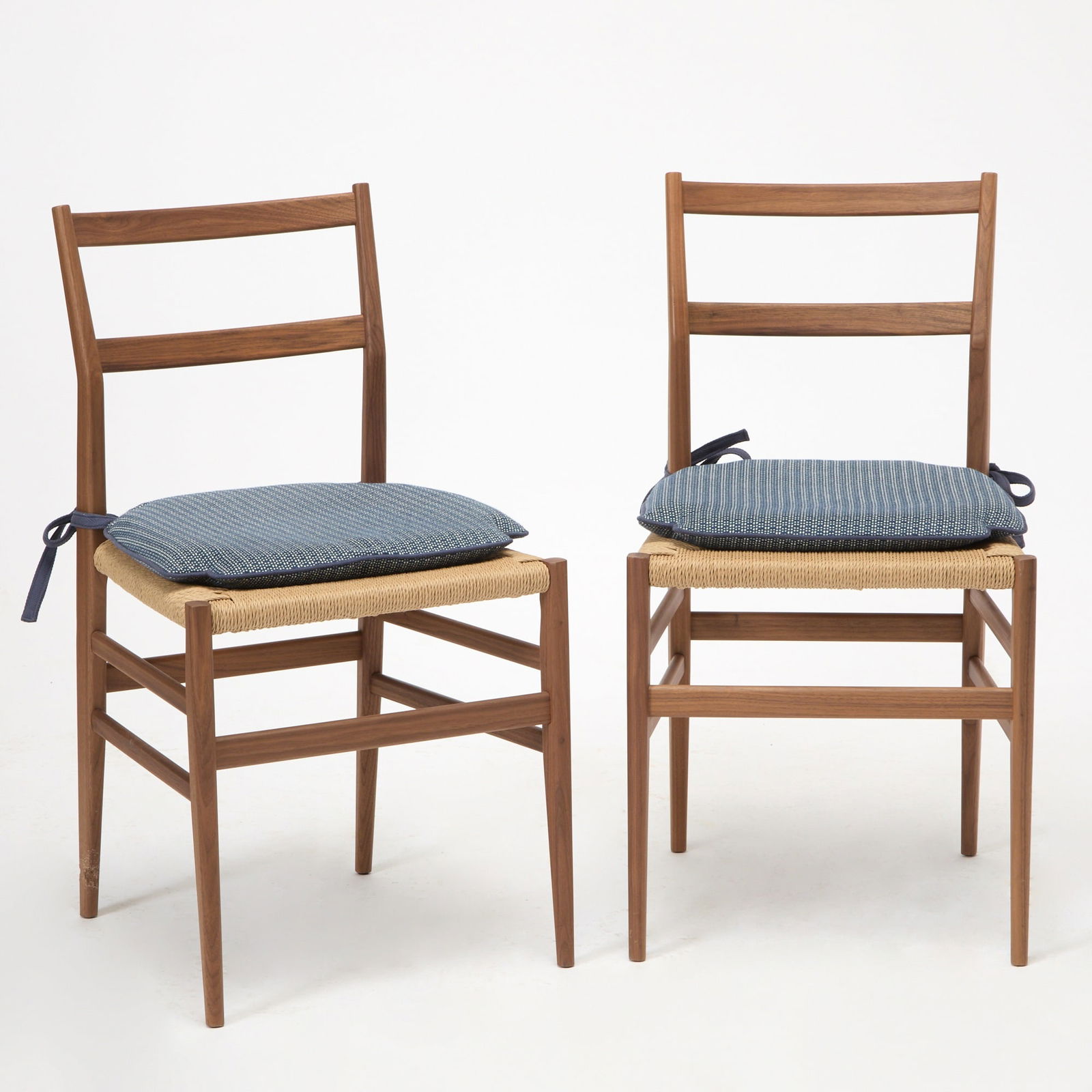 Three Gio Ponti for Cassina Walnut Rush-Seat "Superleggera" Side Chairs: Recent reissue Height of back 33 1/4 inches, height of seat 18 1/4 inches, width 17 1/2 inches, depth 17 inches.