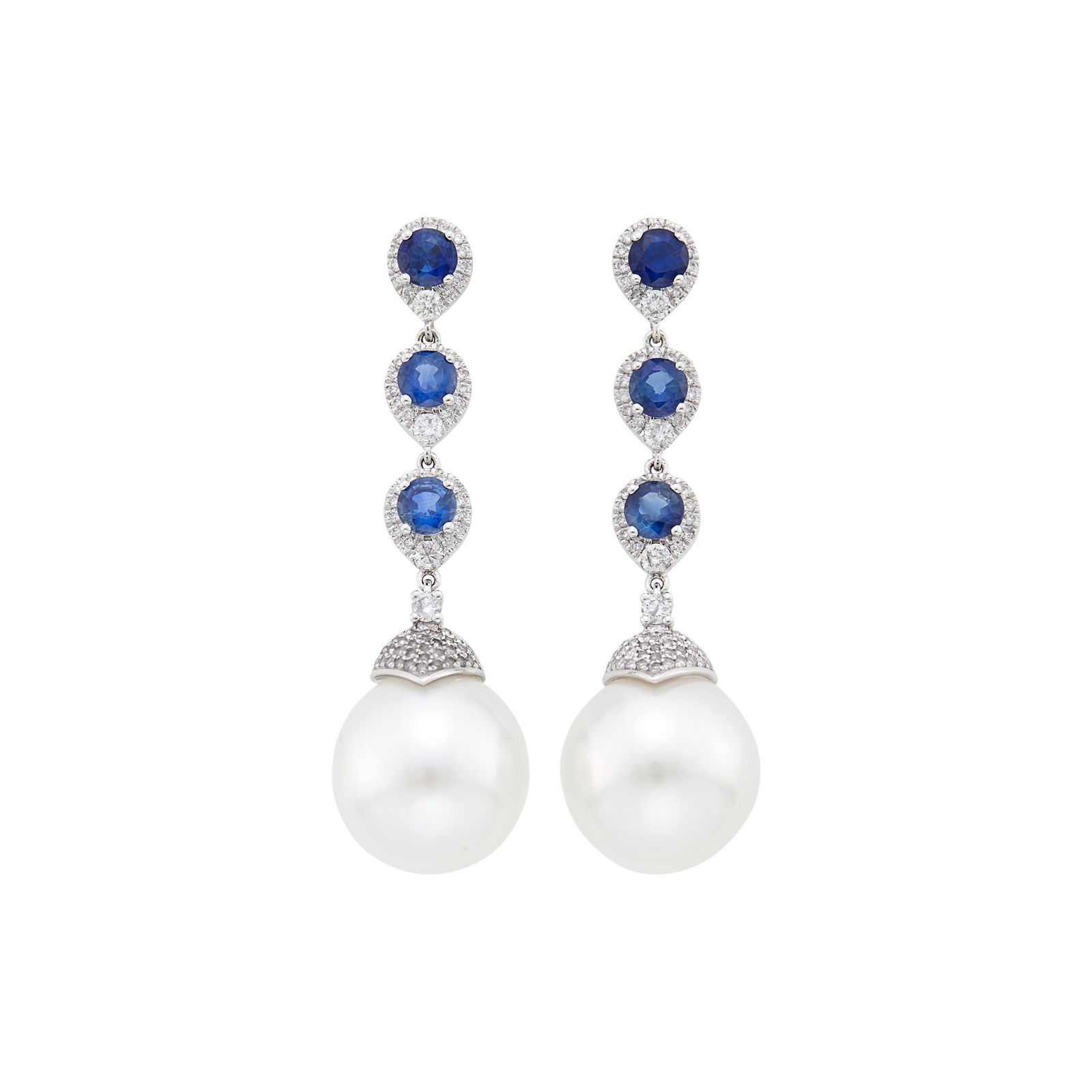 Pair of White Gold, Sapphire, Diamond and South Sea Cultured Pearl Pendant-Earrings: 18 kt., 6 round sapphires ap. 2.20 cts., small round diamonds ap. .85 ct., 2 pearls ap. 13.8 mm. Sapphires: medium to medium deep blue, slightly included, lively.Pearls: white with green and faint