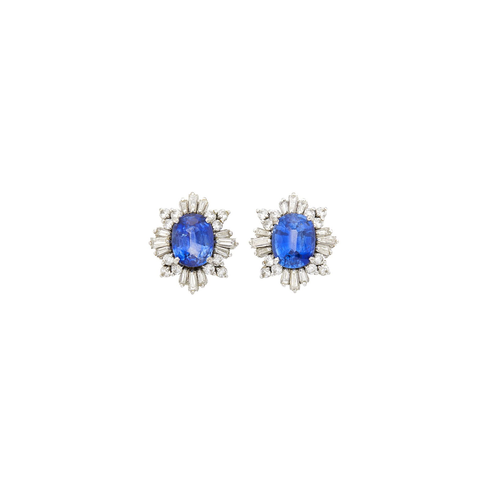 Pair of White Gold, Sapphire and Diamond Earrings: 2 oval sapphires ap. 3.50 cts., 24 round and 24 tapered baguette diamonds ap. 1.45 cts., ap. 3.8 dwts. Test as 14 kt.Sapphires: medium deep cornflower blue, slightly included, lively.Diamonds: