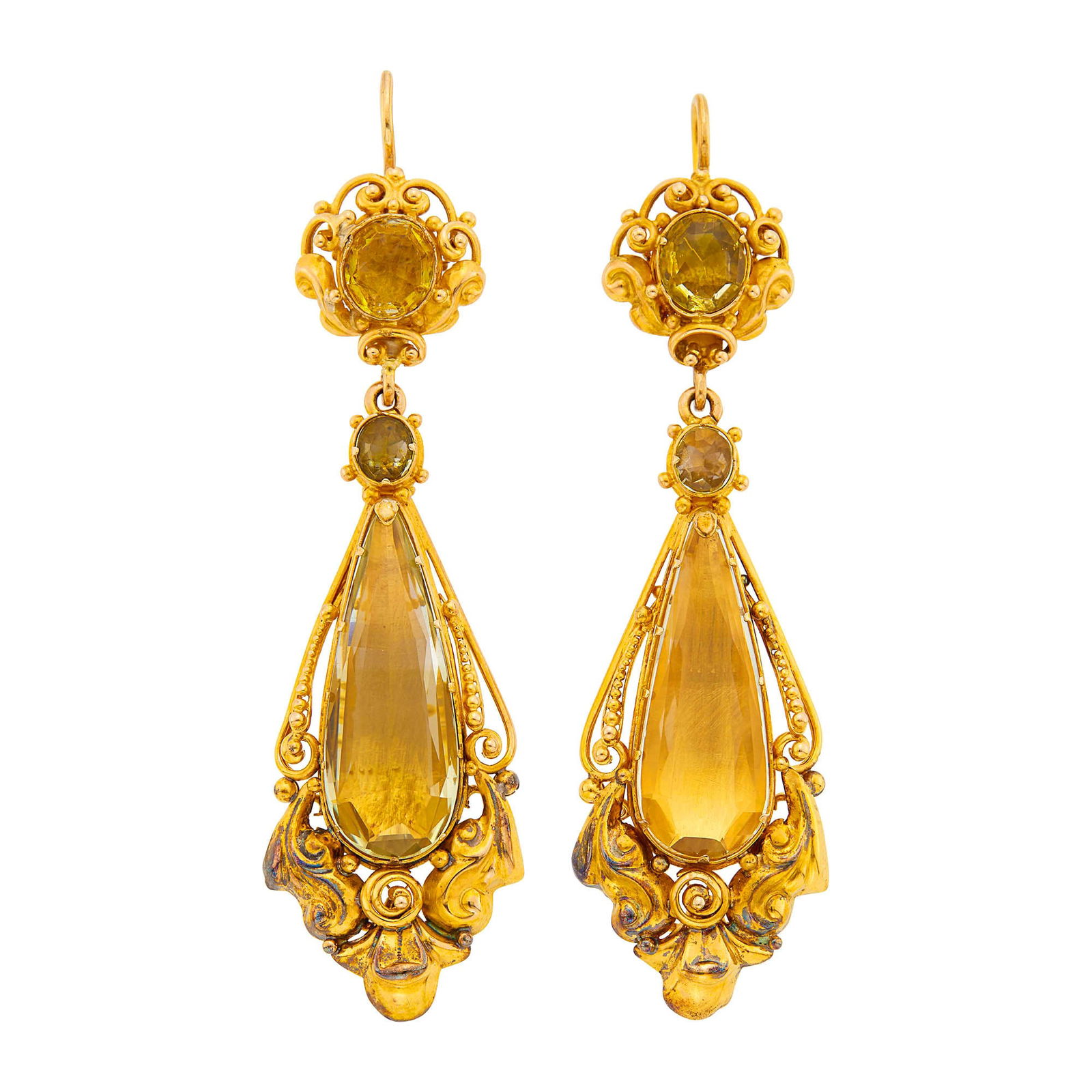 Pair of Antique Gold and Citrine Pendant-Earrings: 2 drop-shaped citrines ap. 25.7 x 9.8 mm., c. 1830, ap. 10 dwts. Tests as 14 kt. Four top stones are deep yellow and olive green. Citrines: light yellow, backed by gold. Hooks. 2 7/8 x 3/4 inches.