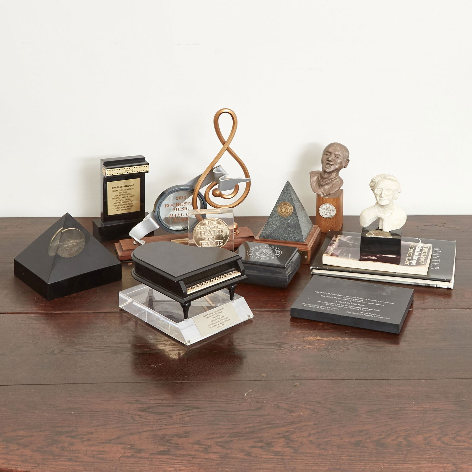 A collection of awards given to Charles Strouse: CHARLES STROUSE A collection of awards given to Charles Strouse. Includes an ASCAP Theater Musical Theater Workshop award, a Songwriter’s Hall of Fame inductee medal, the Elaine Kaufman Cultural