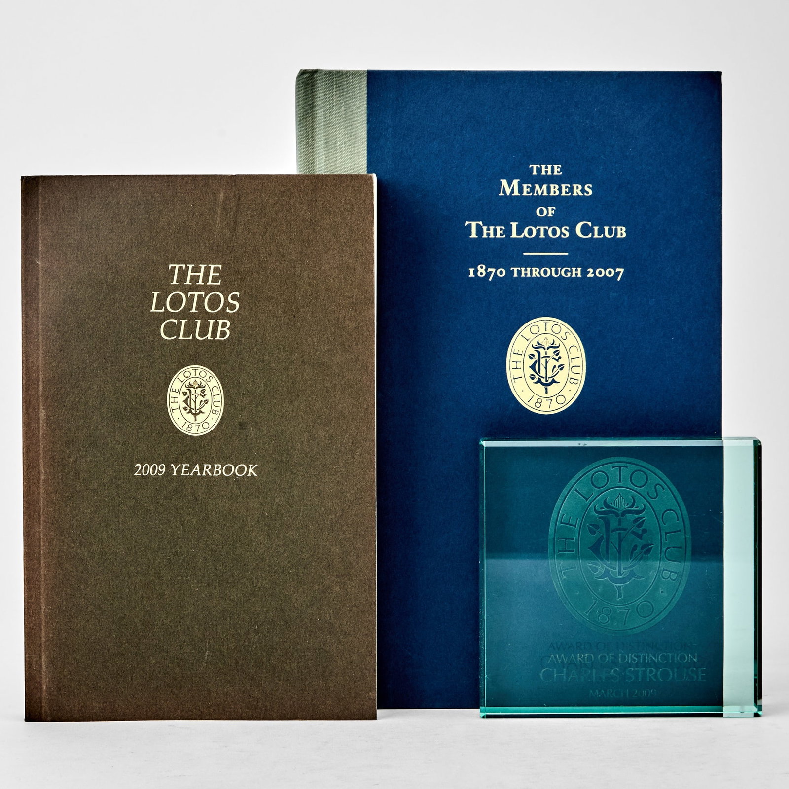 The Lotos Club Award of Distinction presented to Charles Strouse: CHARLES STROUSELotos Club Award of Distinction. Awarded in March 2009. Glass block etched with Lotos Club seal, 4 x 4 inches (10.5 x 10.5 cm.) One small chip and surface scratches. Together with The