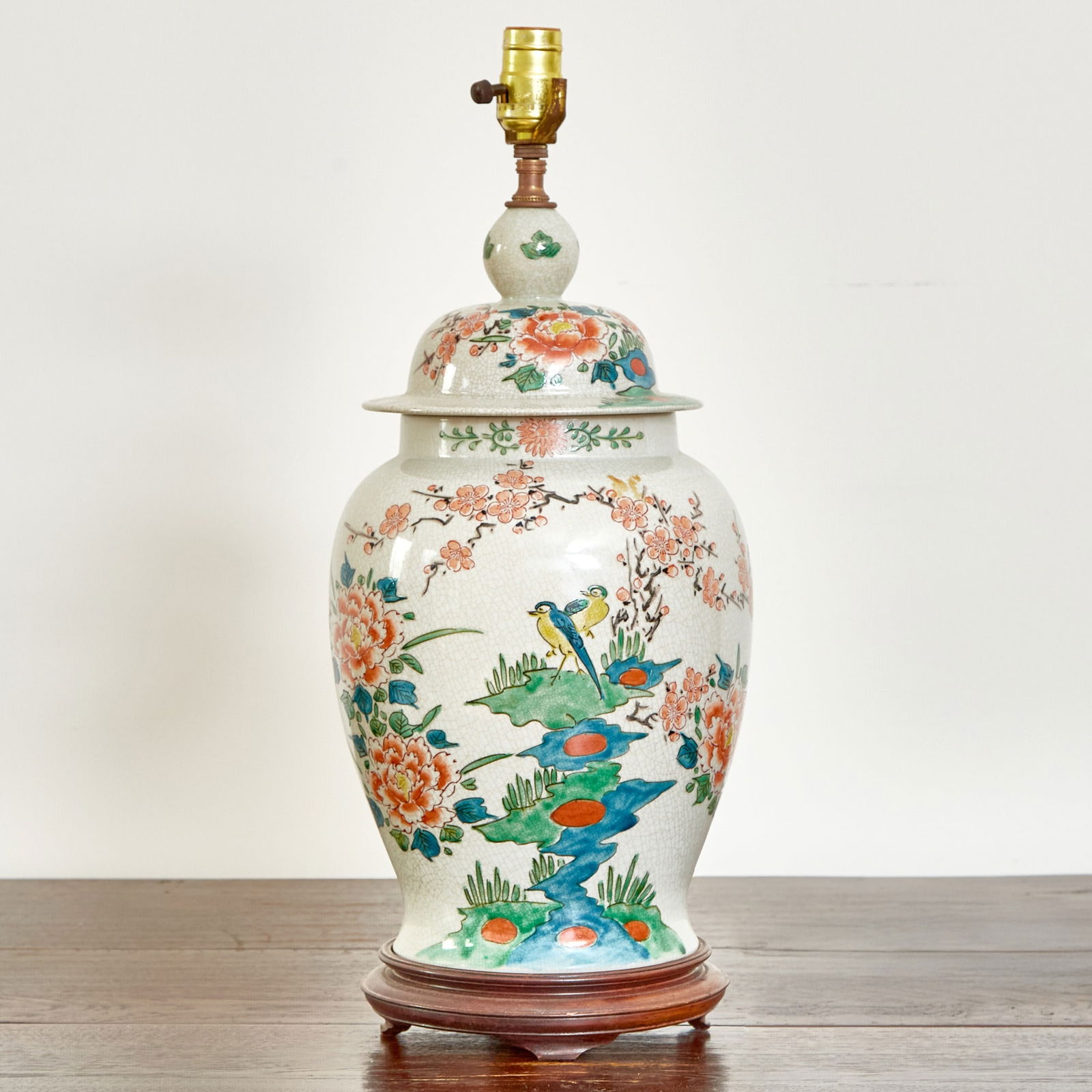 Chinese Style Polychrome Decorated Porcelain Lamp: Featured in the November 1995 Architectural Digest "Broadway at Home" issue. Height 17 inches.
