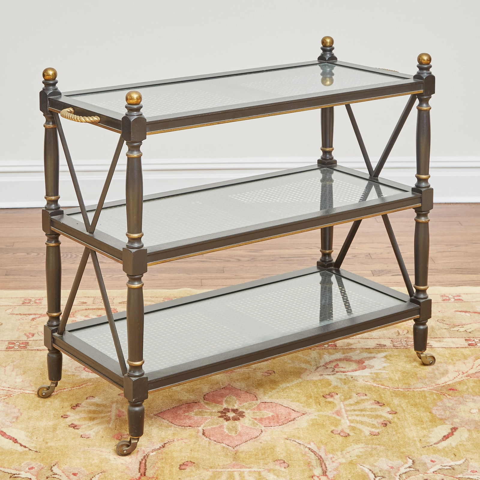 Regency Style Black Painted and Caned Etagere: Height 34 inches, width 37 3/4 inches, depth 15 1/2 inches. one side stretcher loose; edgewear