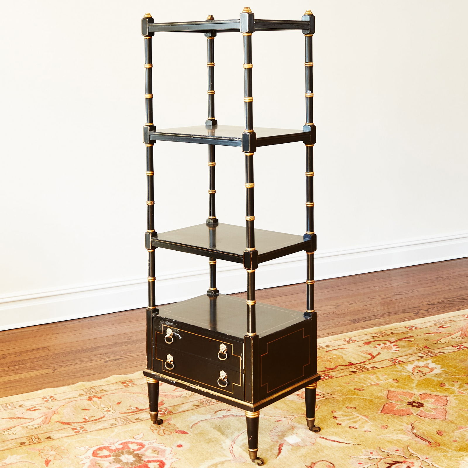 Regency Style Faux Bamboo Black Lacquer and Gilt Decorated Etagere: Height 61 1/2 inches, width 20 1/4 inches, depth 15 1/4 inches. cracking and losses to lacquer; edgewear