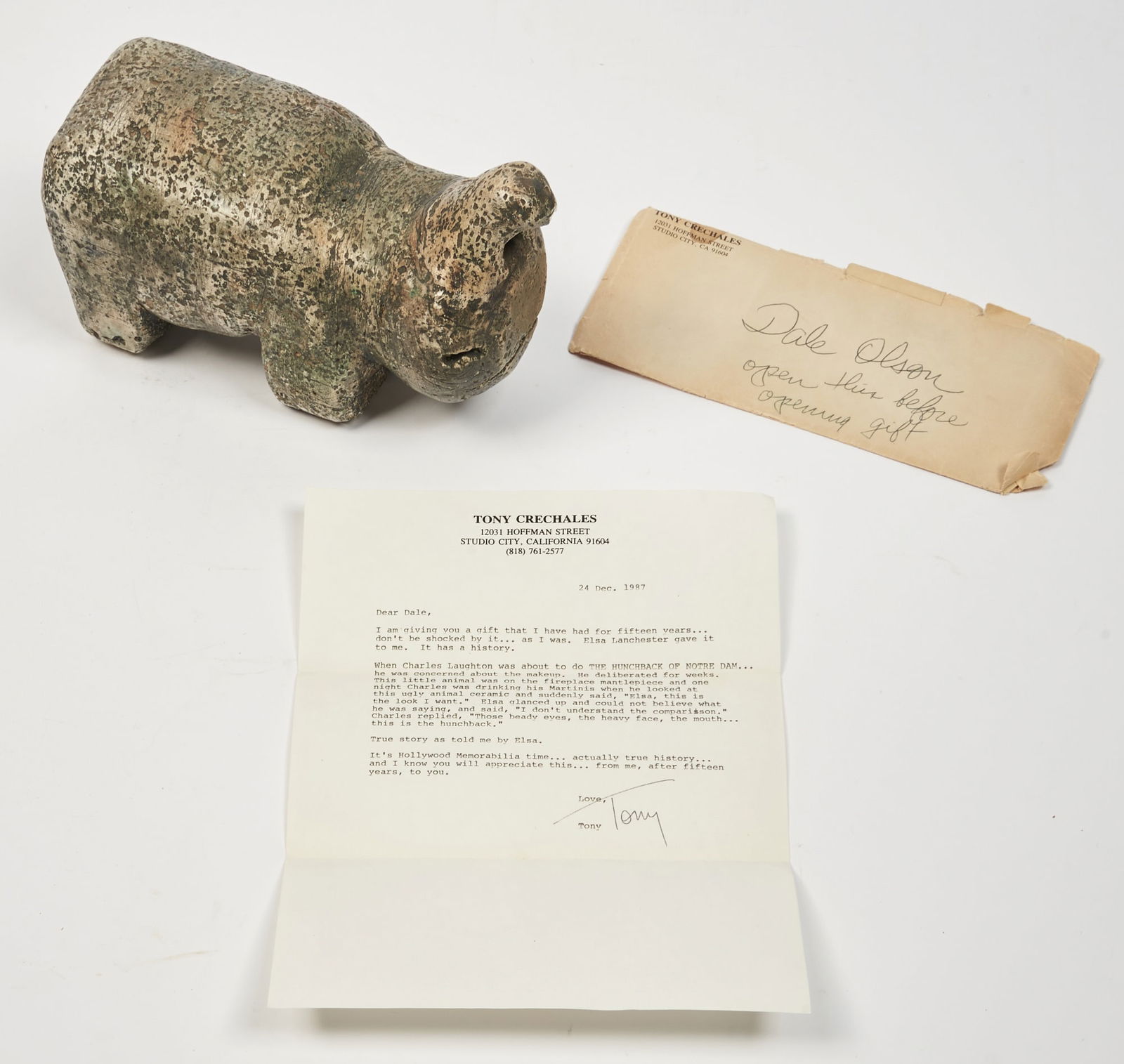 The animal figure that inspired Quasimodo in the Hunchback of Notre Dame: [CHARLES LAUGHTON]Cast tinted plaster Mesoamerican style imaginary animal figurine. Period unknown. Approximately 9 1/2 x 3 1/2 x 4 1/2 inches (23 x 8 x 12 cm.) A few minor chips. Together with a