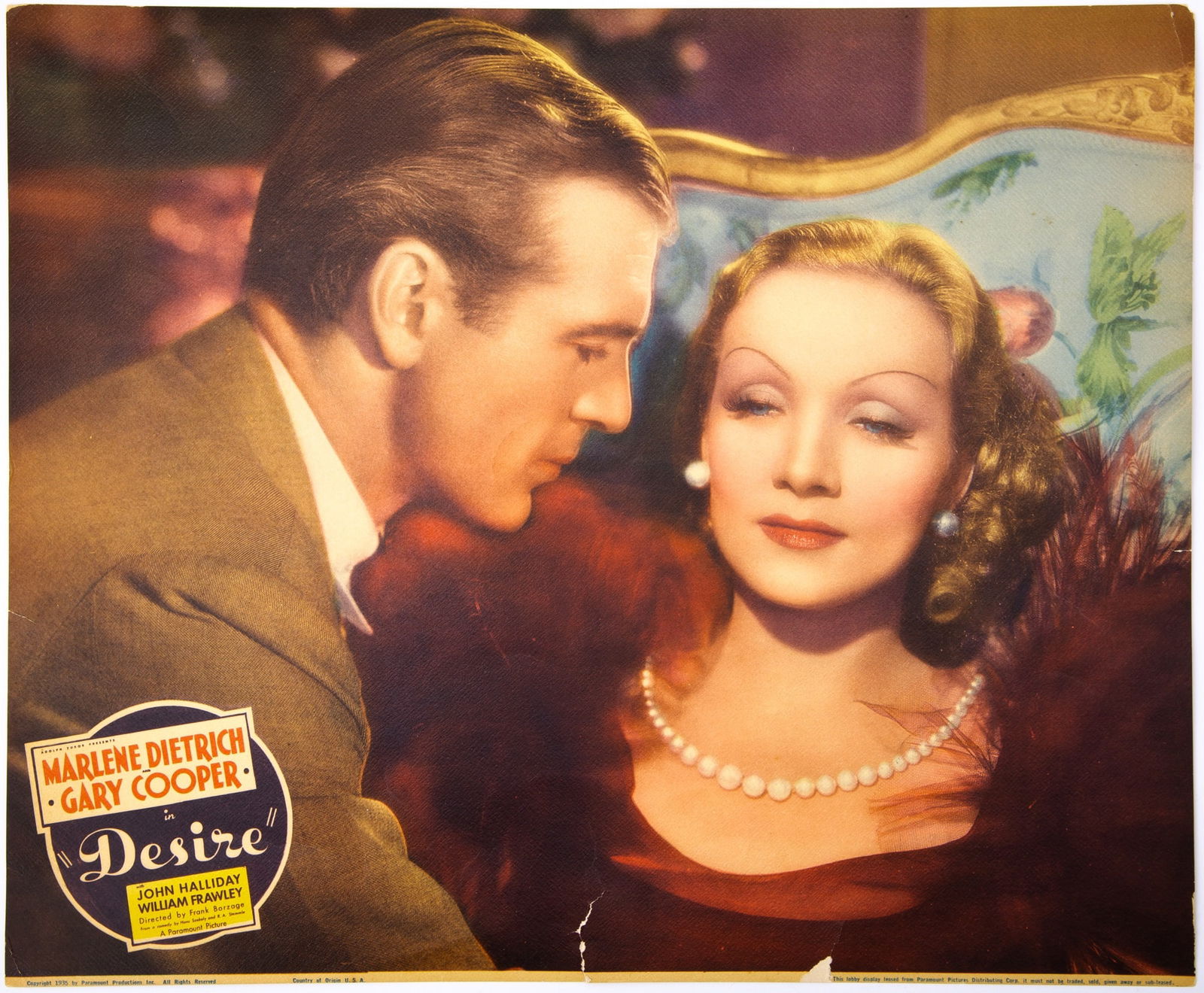 Marlene Dietrich and Gary Cooper in Desire: MARLENE DIETRICH and GARY COOPER Lobby card for Desire. Paramount, 1935. Color lithograph on textured paper, 17 x 14 inches (43 x 35½ cm). Surface wear, with a few creases, a closed tear ab