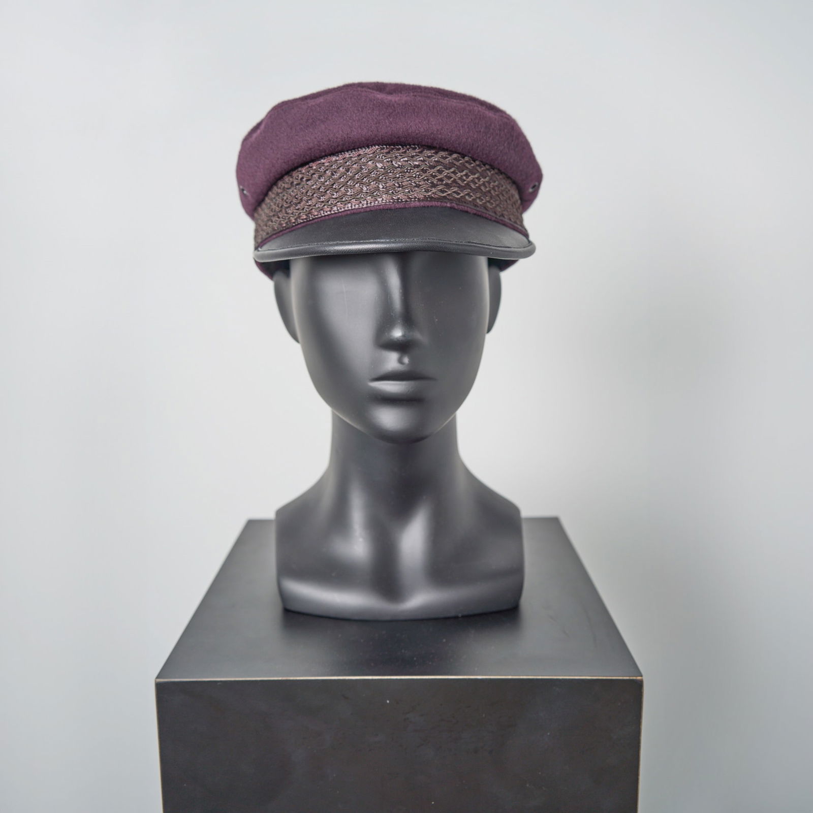 Susie Myerson's iconic Newsboy Cap worn on screen in The Marvelous Mrs. Maisel: THE MARVELOUS MRS. MAISEL A newsboy cap worn by Alex Borstein as Susie Myerson in The Marvelous Mrs. Maisel. Purple Wool with Embroidered Trim Accents and Black Brim by Emmy-winning Costume Designer D