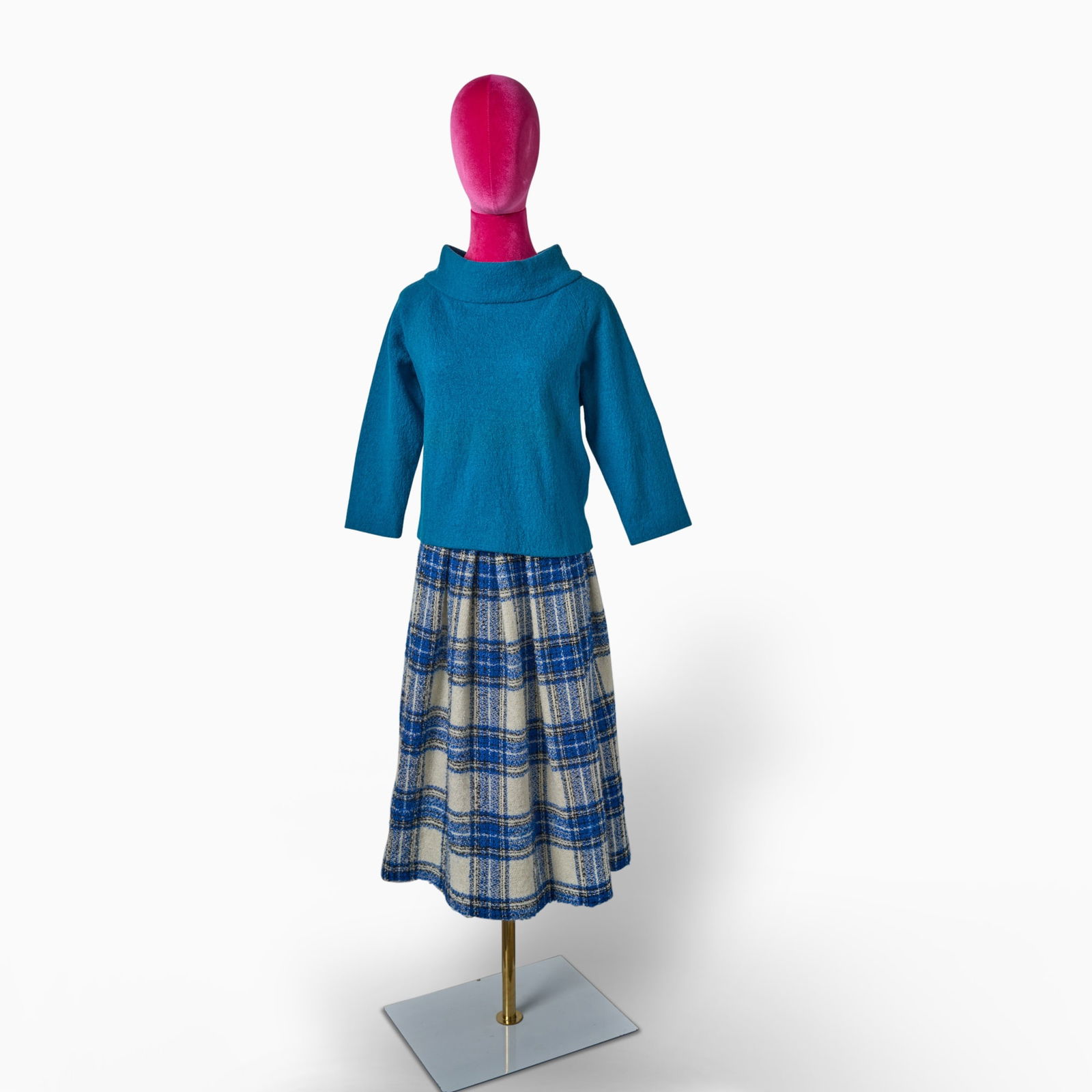 Rose Weissman's blue sweater and skirt worn on screen in The Marvelous Mrs. Maisel: THE MARVELOUS MRS. MAISEL Costume Worn by Marin Hinkle as Rose Weissman in The Marvelous Mrs. Maisel. Blue Cowl Neck Top and Blue Wool Tartan Pattern Skirt made by Emmy-winning Costume Designer Donna