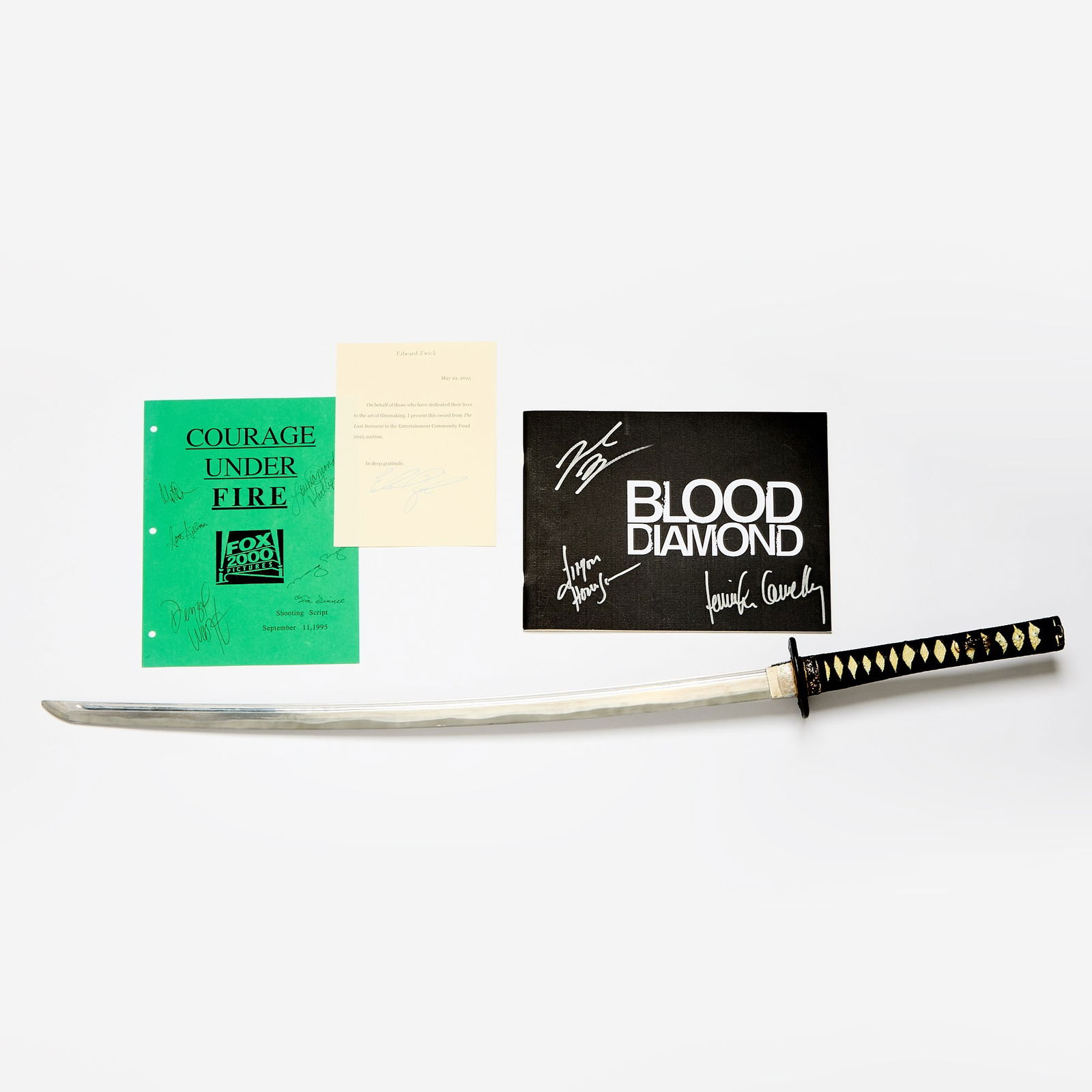 A Samurai sword prop featured in The Last Samurai and an item signed by Leonardo DiCaprio: THE LAST SAMURAI A Samurai sword prop featured in The Last Samurai. A metal Samurai sword with a thick blade (a prop), the handle fabric-wrapped and accented in gold, with sheath, overall 40 inches lo